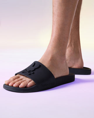 on-model view of bunny logo slides in black