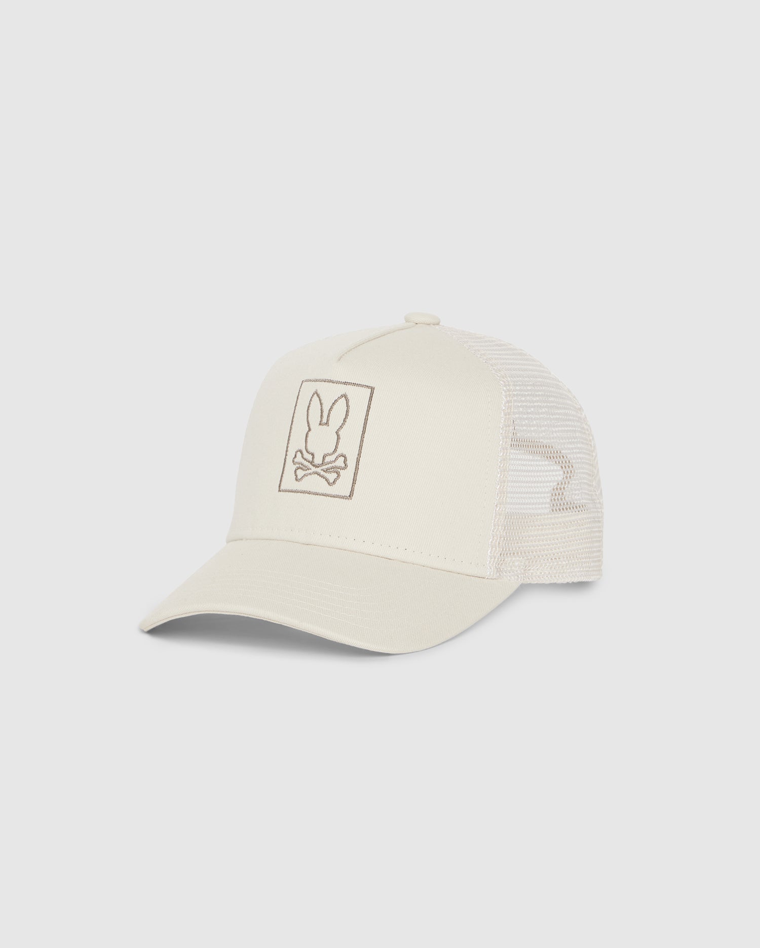 A Psycho Bunny KIDS LIVINGSTON TRUCKER CAP - B0A401B200 in beige featuring an embroidered peace sign resembling a hand gesture on the front panel, photographed on a white background.