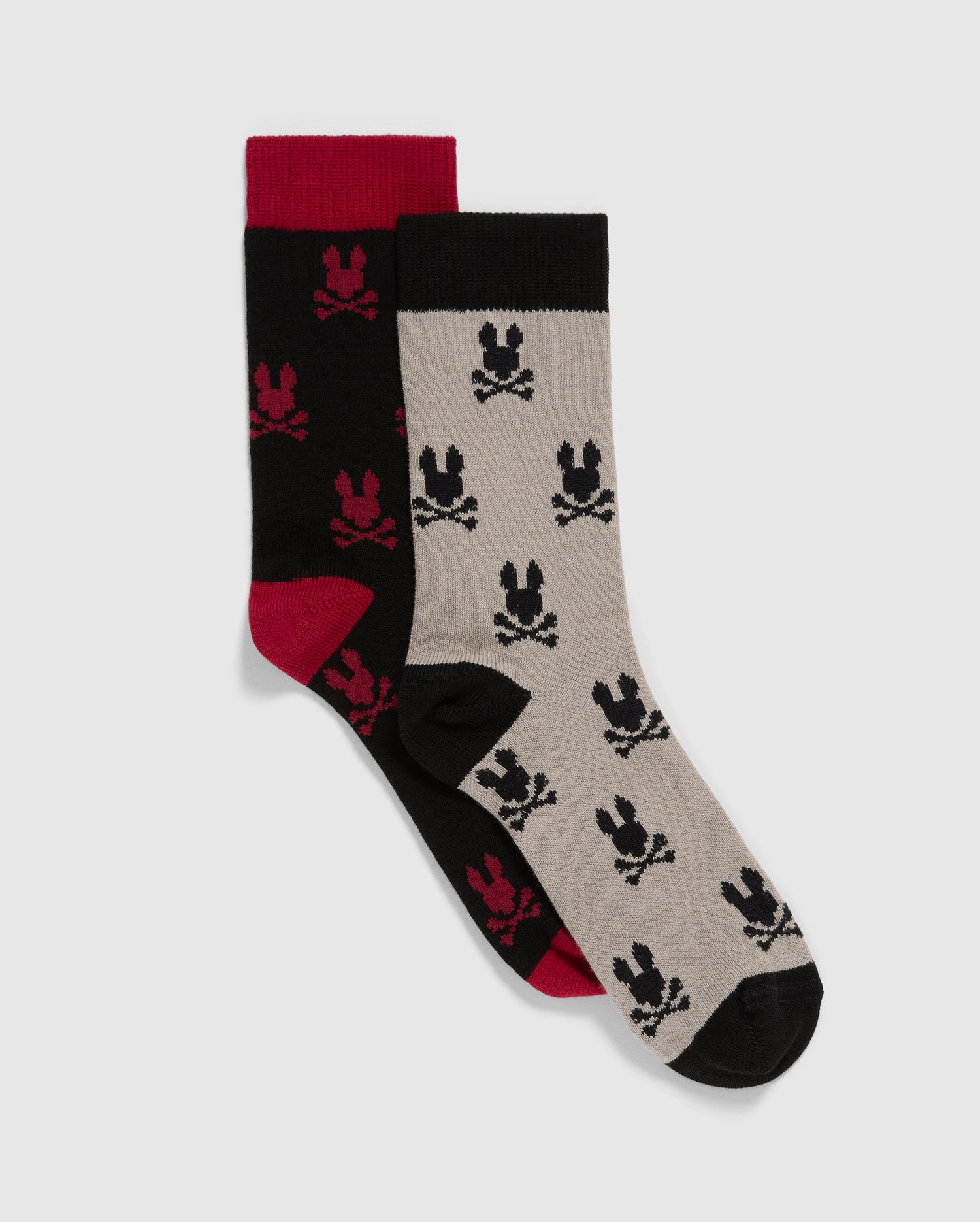 A pack of Psycho Bunny kids' dress socks (2 pairs) adorned with skulls, meticulously crafted from luxurious Peruvian Pima cotton.