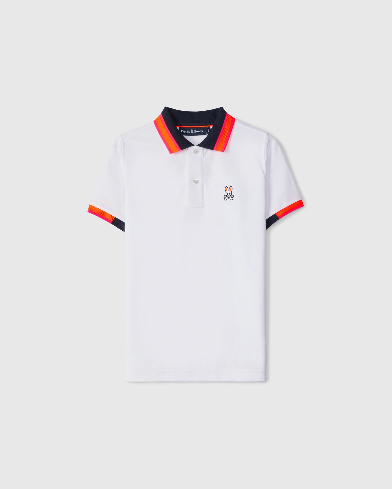 A classic and bold white KIDS WOODSTOCK PIQUE POLO SHIRT - B0K141B200 from Psycho Bunny featuring contrasting black and red-orange stripes on the textured-knit collar and sleeve ends. The shirt showcases a small embroidered rabbit logo on the left chest and has a button-up placket at the neckline.