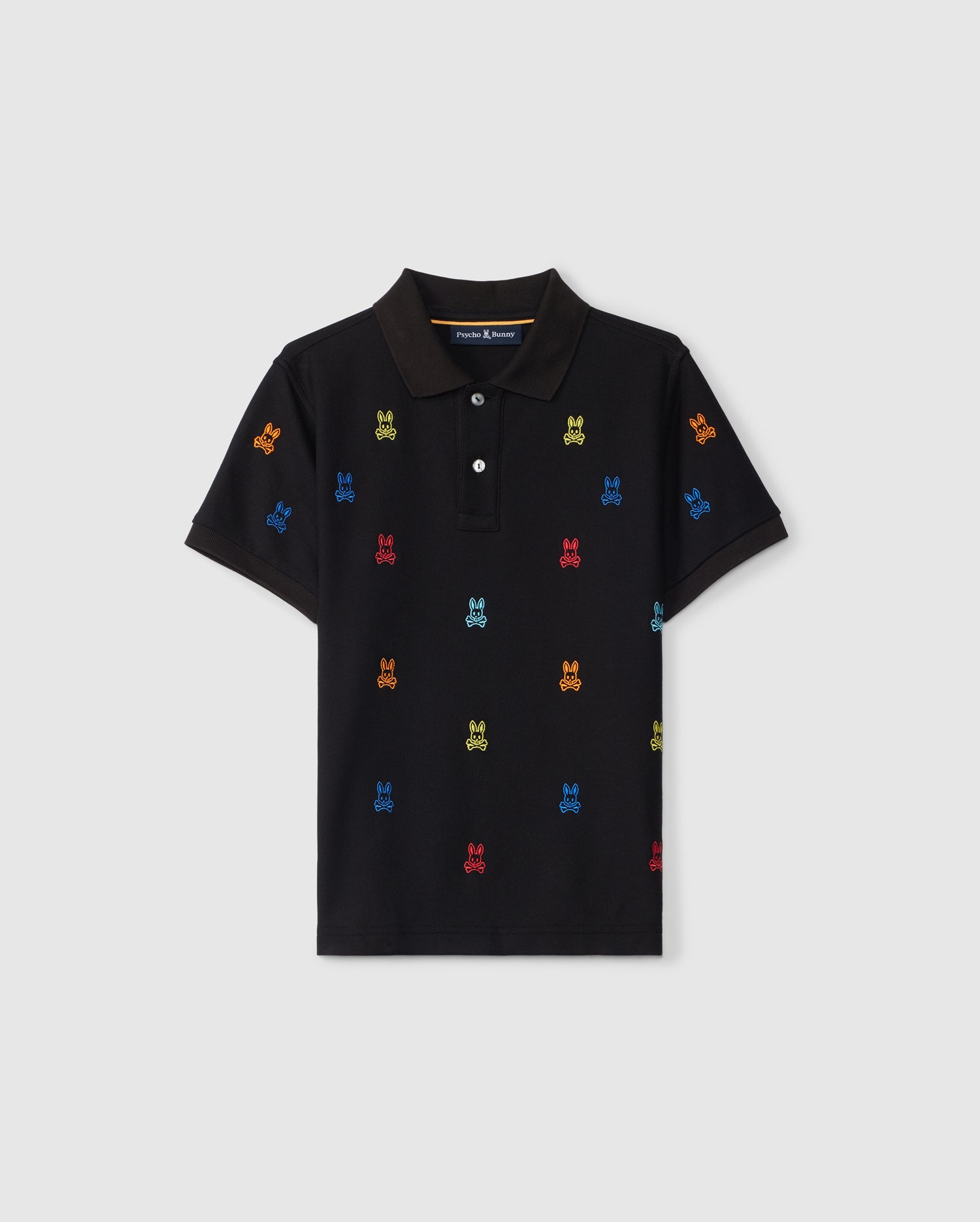 A black KIDS BONHAM ALL OVER BUNNY PIQUE POLO - B0K501C200 by Psycho Bunny, crafted from soft Pima cotton, features a colorful embroidered pattern of small, playful robots in red, blue, green, and yellow. Evenly spaced across the fabric, the shirt has short sleeves and a classic collar with a three-button placket.