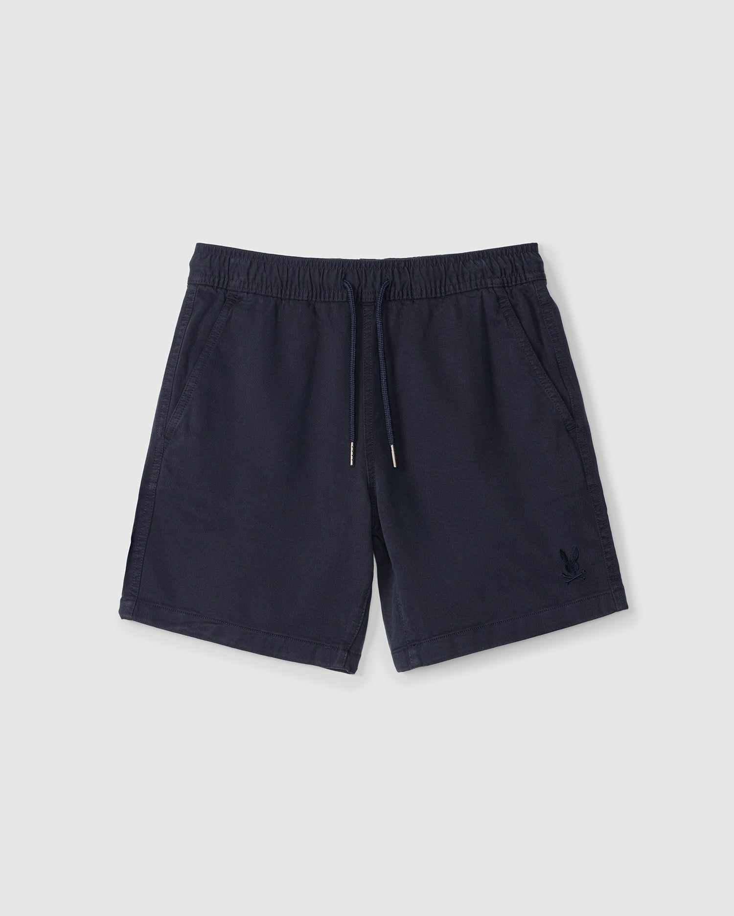 Navy blue Psycho Bunny kids' Willis Stretch Tencel shorts with an elasticized waistband and drawstring, featuring a small embroidered logo on the left leg, displayed on a plain white background.