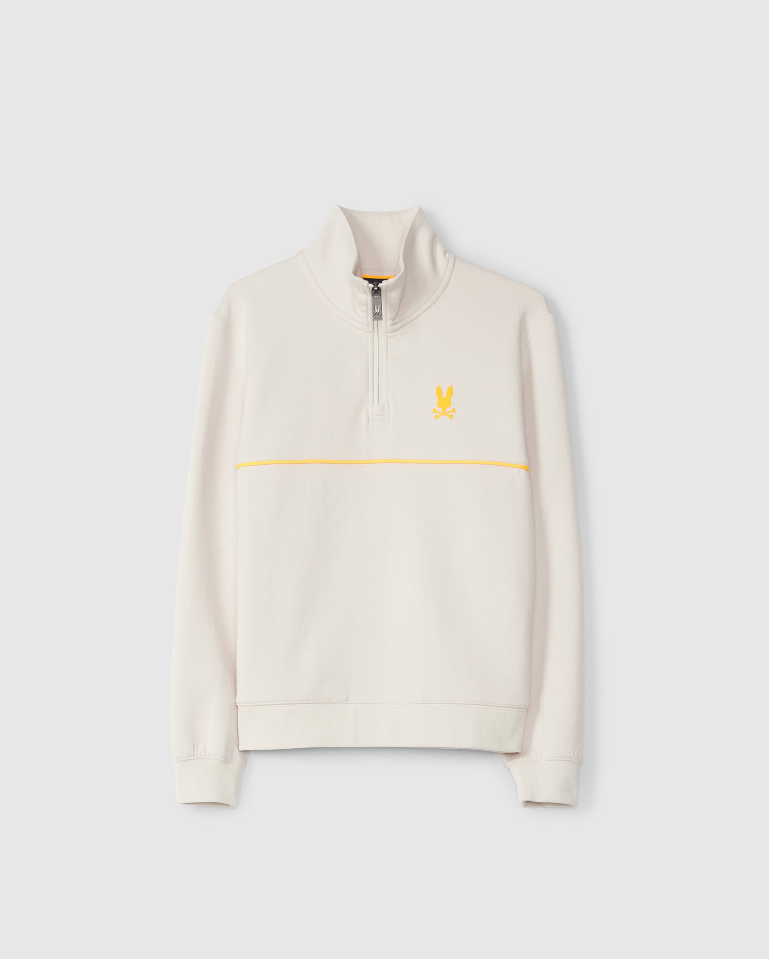 A cream-colored quarter-zip sweatshirt featuring a standing collar. Crafted from soft modal-blend fleece, the KIDS LEON HALF ZIP - B0S204B200 by Psycho Bunny has a zipper down the top half and a yellow stripe running horizontally across the chest, with a yellow embroidered rabbit emblem on the left chest area.