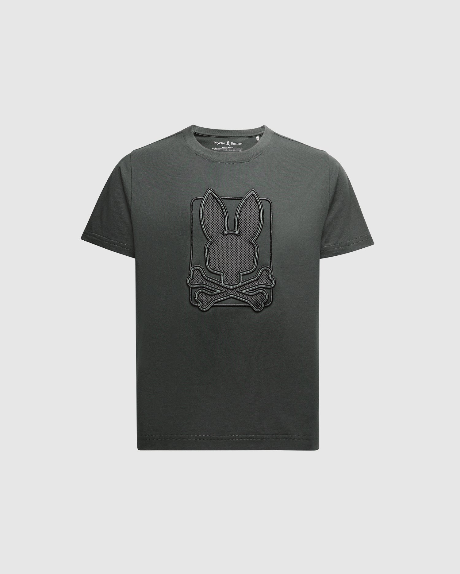 The Psycho Bunny KIDS PIERCE GRAPHIC TEE - B0U115E200 features a dark green color in Pima cotton, with an embroidered design of a rabbit face and crossed bones on the front.