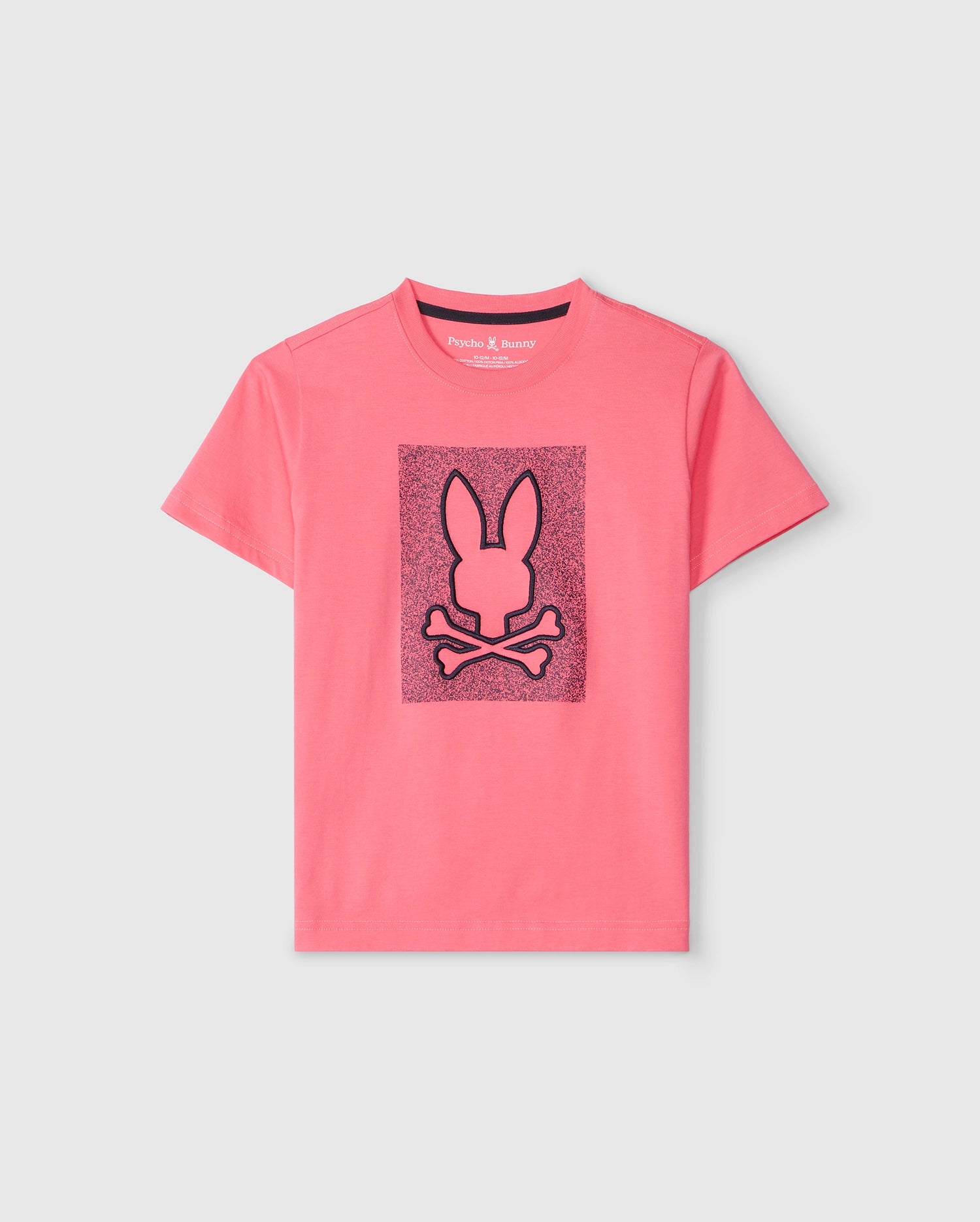The KIDS LIVINGSTON GRAPHIC TEE - B0U247B2TS, crafted from luxurious Peruvian Pima cotton, showcases a pink T-shirt with a striking black bunny design featuring a bunny head above crossed bones. The textured darker pink background adds depth to the graphic, all set against a light grey backdrop. This stylish item is brought to you by Psycho Bunny.
