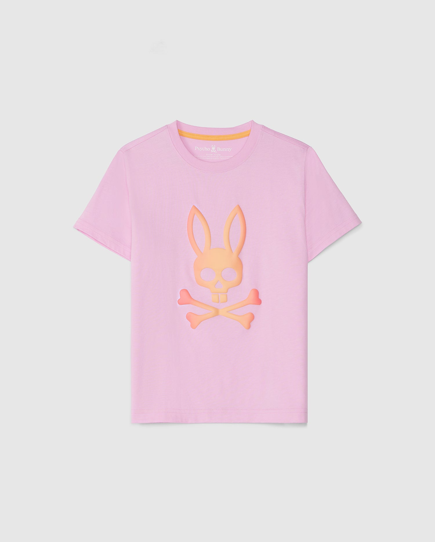 Discover this adorable pastel pink KIDS NORWOOD GRAPHIC TEE - B0U311B2TS by Psycho Bunny made from ultra-soft Peruvian Pima cotton, featuring an HD-printed bunny head above crossbones in a yellow and pink gradient. The playful design is perfectly centered on the front, displayed crisply against a plain white background.