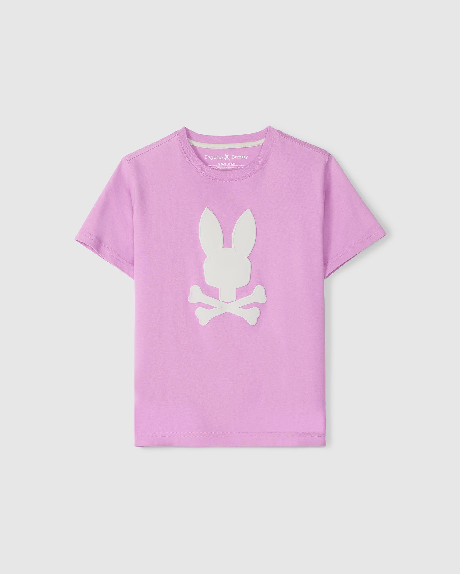 A pink children's KIDS HOUSTON GRAPHIC TEE - B0U607C200 from Psycho Bunny featuring a white silhouette of a bunny sitting over crossed bones, displayed against a plain background.