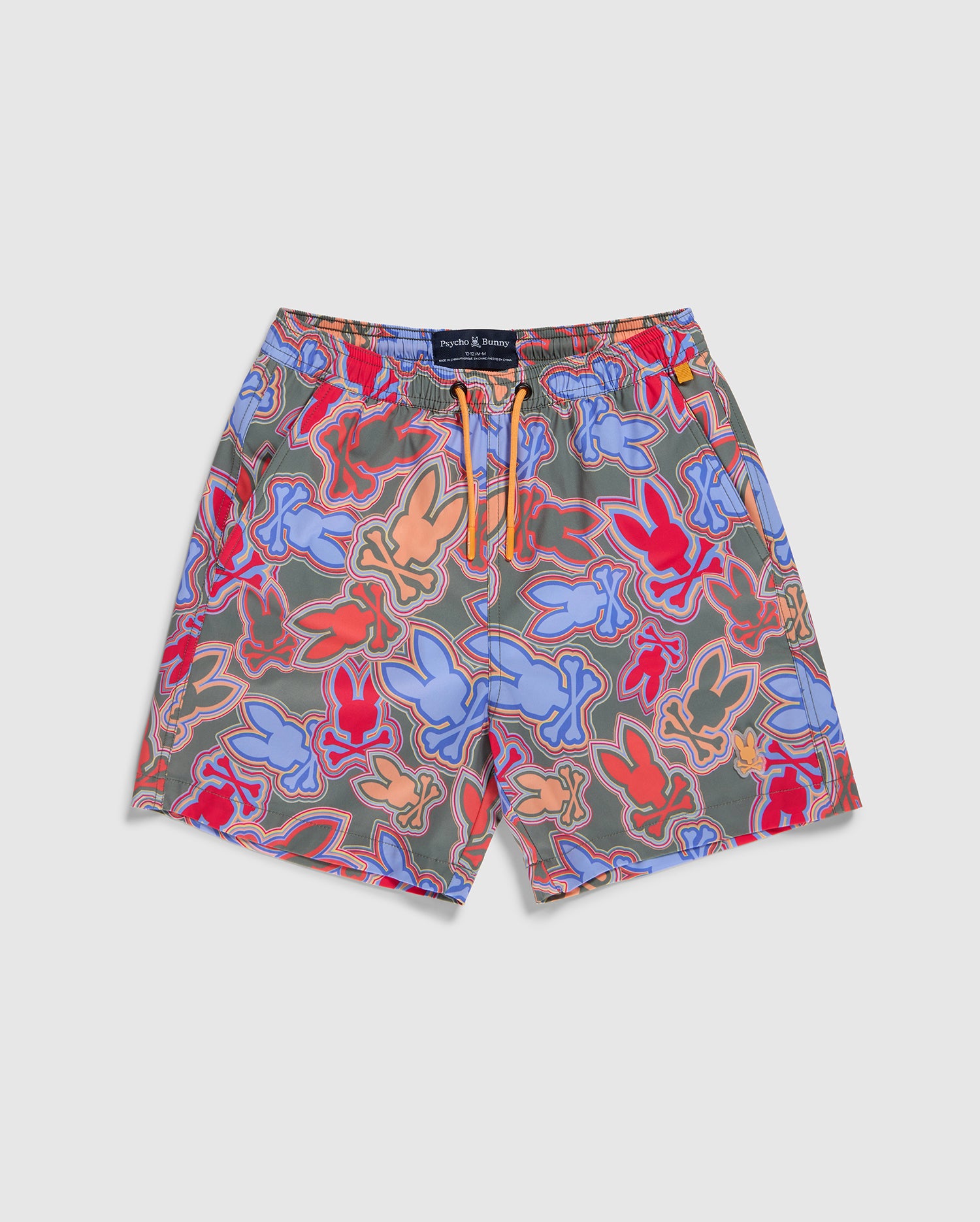 Bright, vibrantly patterned swim shorts featuring colorful overlapping abstract designs in shades of blue, purple, pink, and orange. Made from recycled polyester, the KIDS JACKSON SWIM TRUNK - B0W370B2SW by Psycho Bunny are quick-dry kids' swim trunks with an elastic waistband with an orange drawstring and a black label above the waistband.