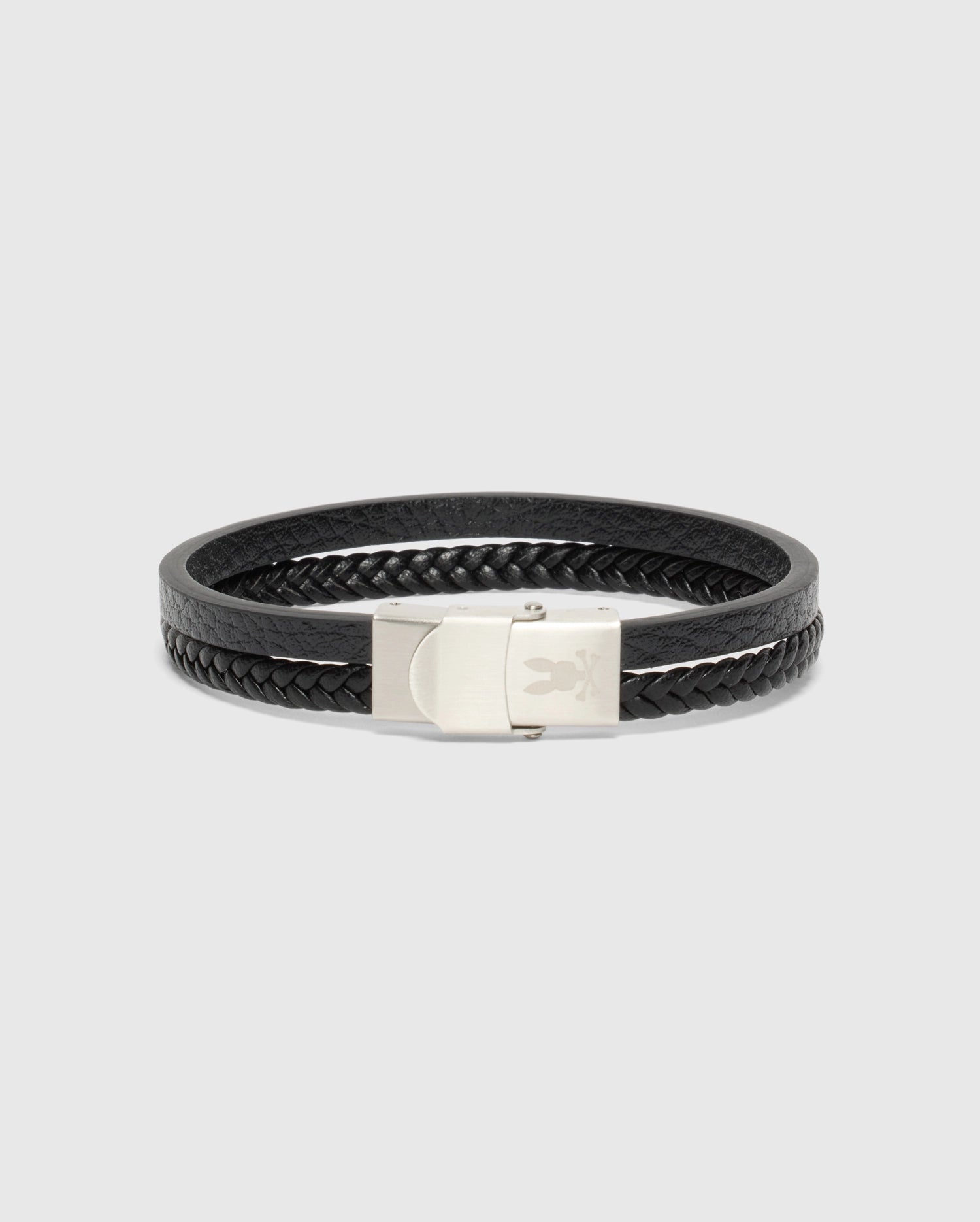 The MEN'S DOUBLE LEATHER BRACELET - B6A387E200 from Psycho Bunny is a fashionable accessory in sleek black, showcasing a woven texture and secured with a metallic clasp, displayed against a plain white background.