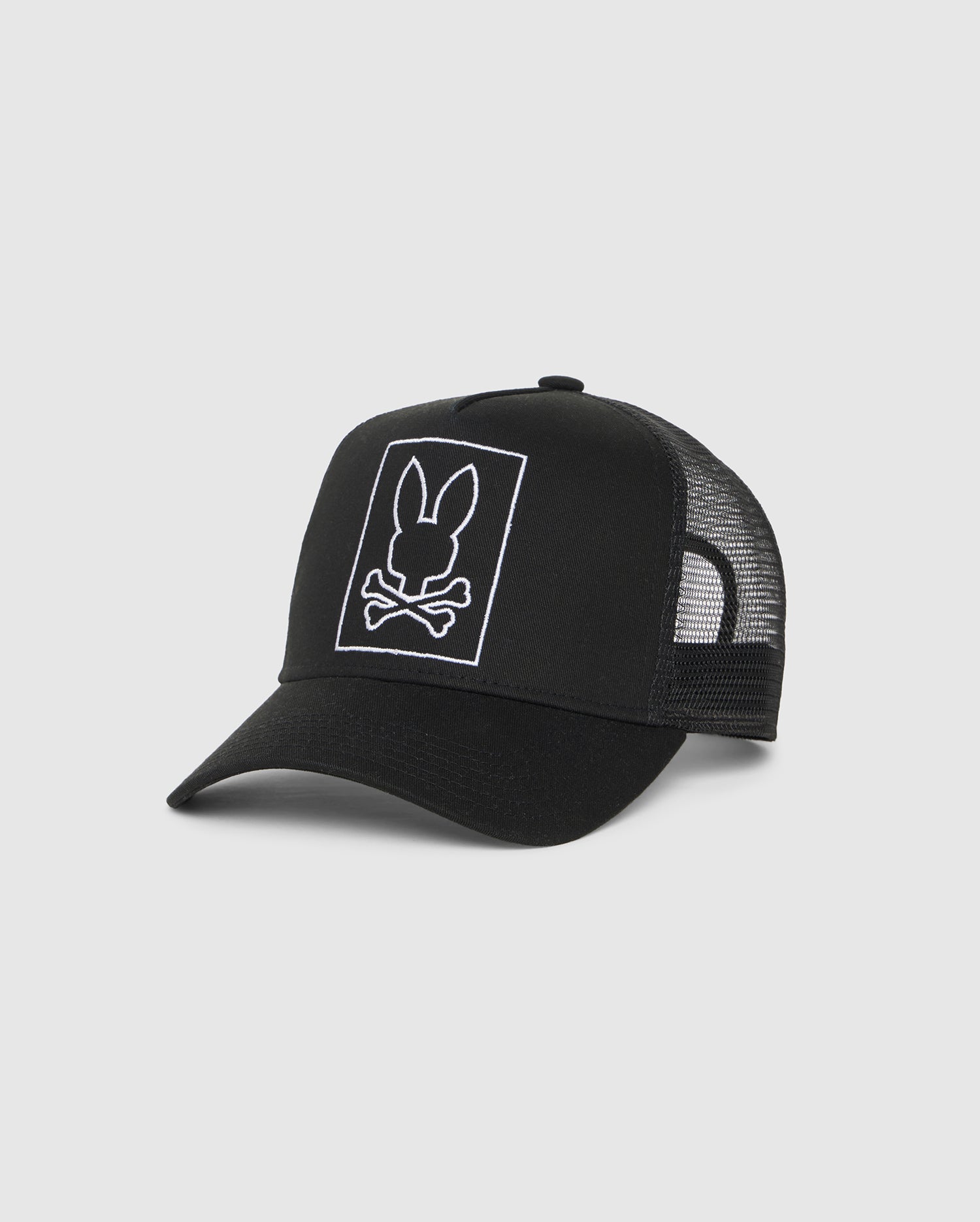 A black Psycho Bunny Livingston trucker hat with an embroidered bunny design on it.
