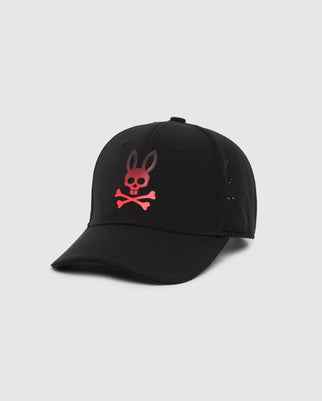 The Psycho Bunny Men's Maxwell Sport Cap (B6A783D200) is crafted from 100% cotton and boasts a sleek black design. It prominently features a red skull and crossbones with bunny ears on the front, set against a plain white background. This stylish cap includes a curved brim and perforated panels at the back for enhanced ventilation.