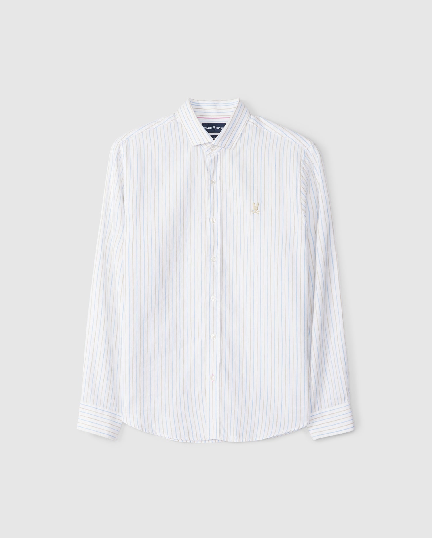 A Psycho Bunny MENS WEST LINEN LONG SLEEVE SHIRT - B6C587C200 with light blue vertical stripes, featuring long sleeves and a small embroidered logo on the left chest. The striped shirt has a classic collar and is neatly arranged against a plain, light gray background.