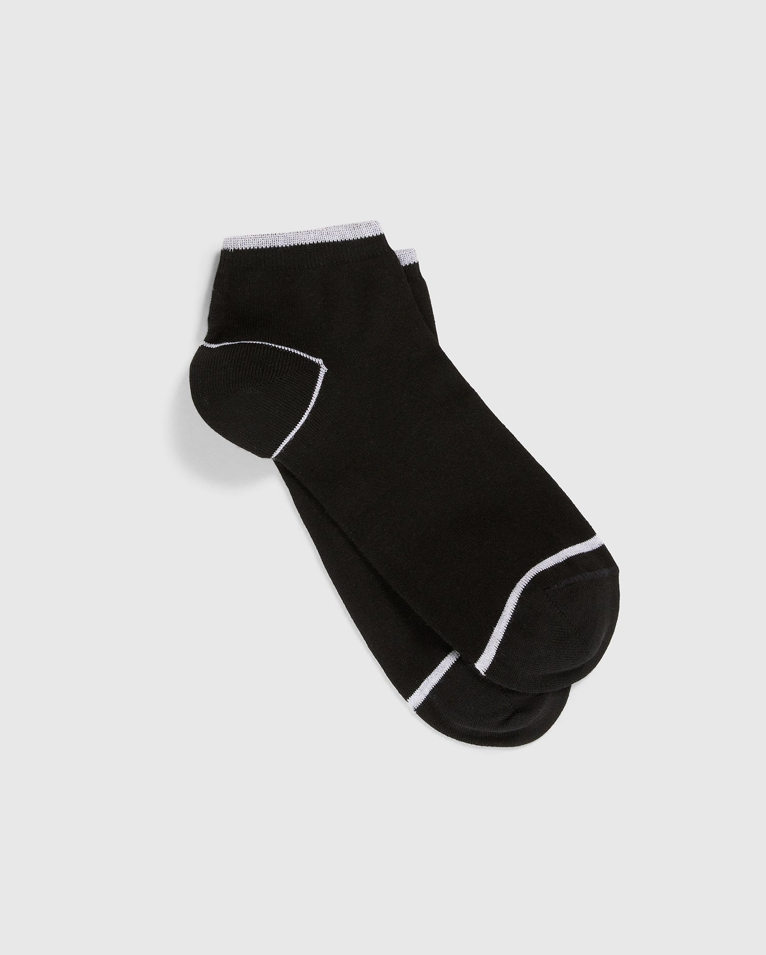 A pair of Psycho Bunny's MENS ANKLE SOCKS - B6F482C200 in black Pima cotton with white trim around the cuffs, toes, and heels, laid flat on a white background. The socks feature an embroidered Bunny for a touch of charm amidst their simple and plain design.