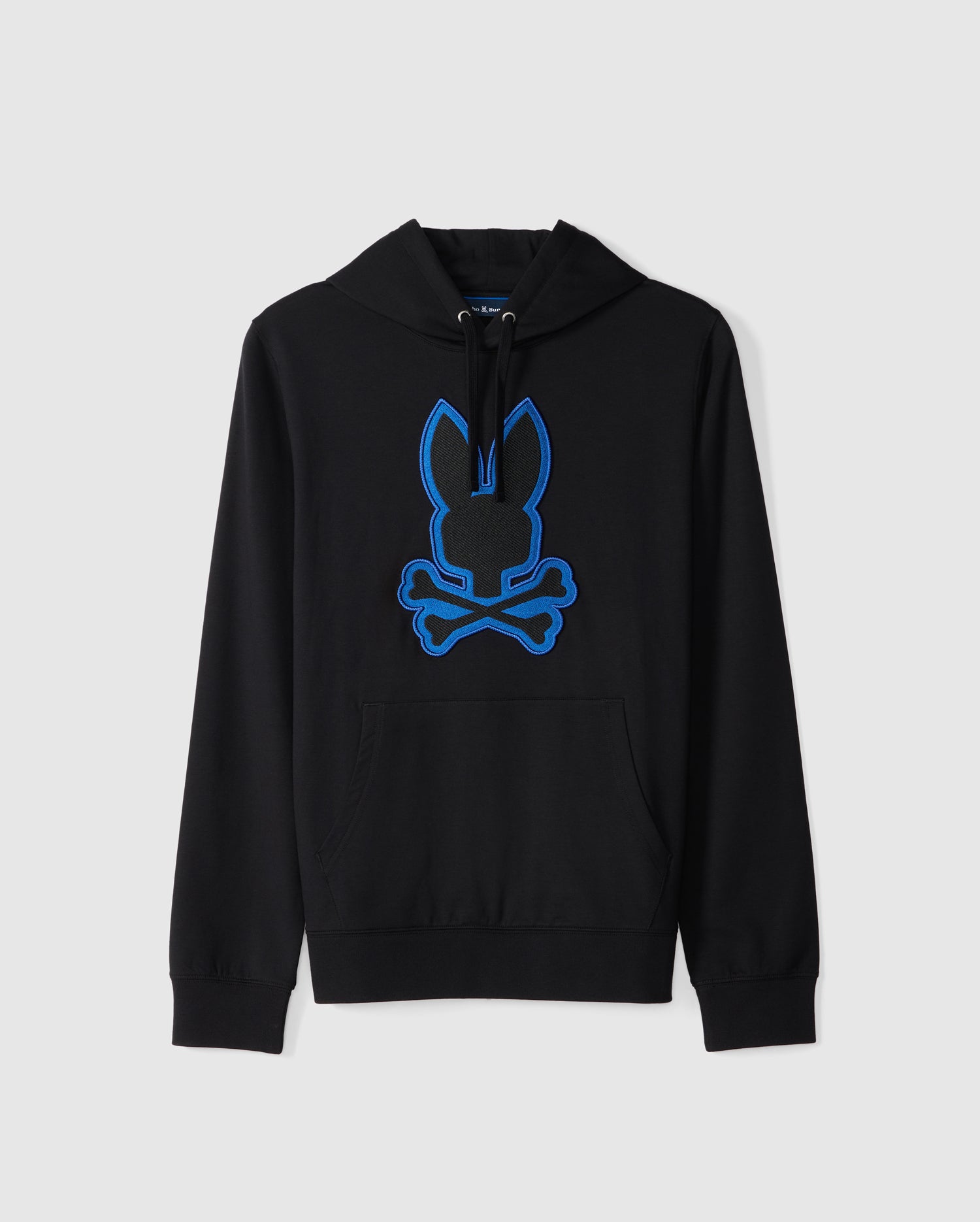 The Psycho Bunny MENS WALTER LIGHTWEIGHT HOODIE - B6H476D200 is a black micro-French terry hoodie featuring a blue outline of a bunny head and crossed bones on the front. It comes with a drawstring hood and a large front pocket, showcasing a modern twist on classic French terry fleece against a plain white background.