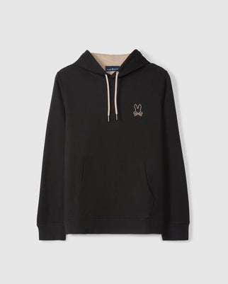 The MENS JAMES PREMIUM HOODIE - B6H789D200 by Psycho Bunny in black is made from essential fleece, featuring a front pocket, light beige drawstrings, and a small embroidered bunny graphic on the top left corner.