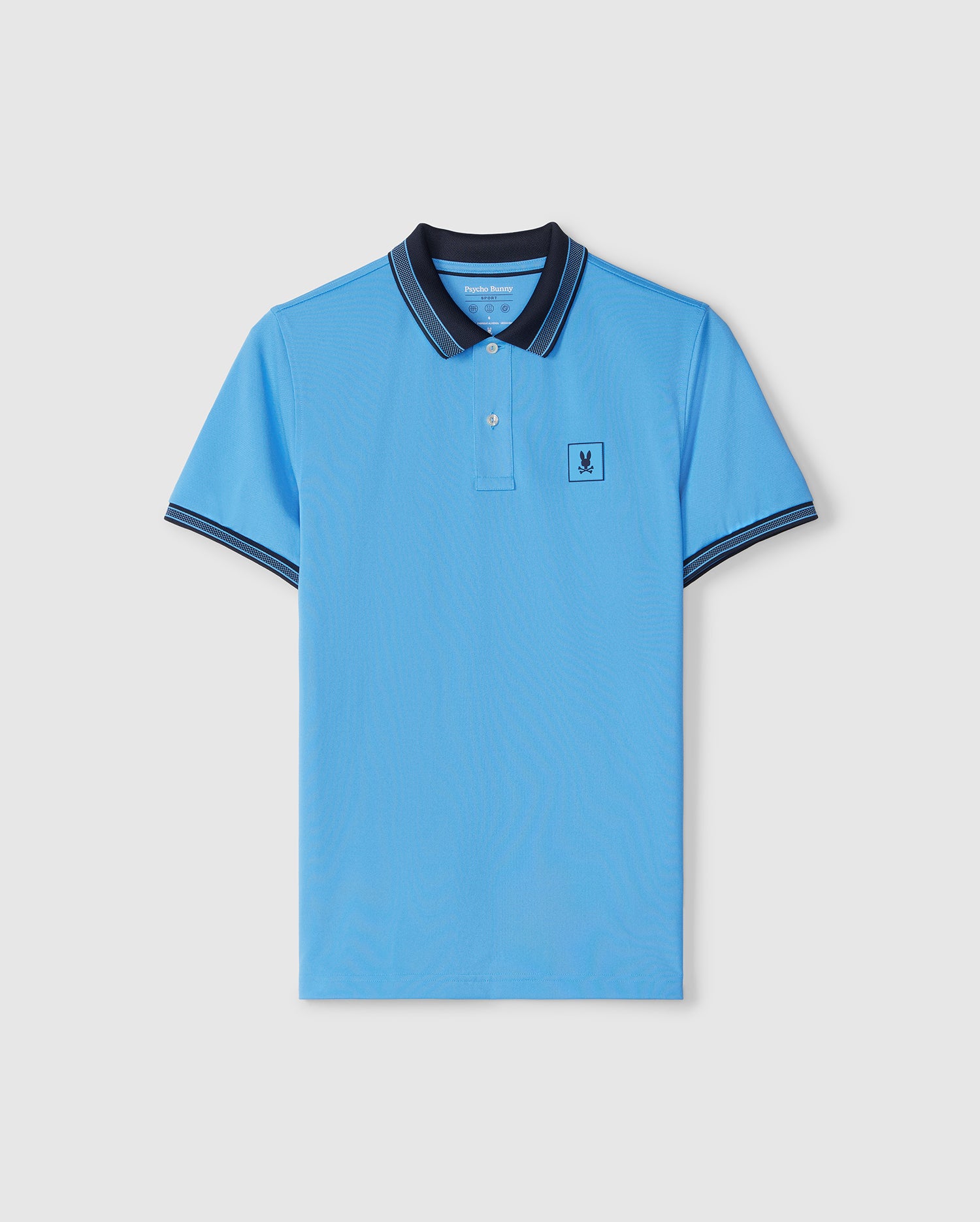A sky blue Psycho Bunny MENS TARRYTOWN SPORT POLO - B6K333B200 with dark blue edges on the collar and sleeves. The shirt, part of our sport-forward line, features a small embroidered logo on the left chest and is crafted from breathable material. The background is plain white.