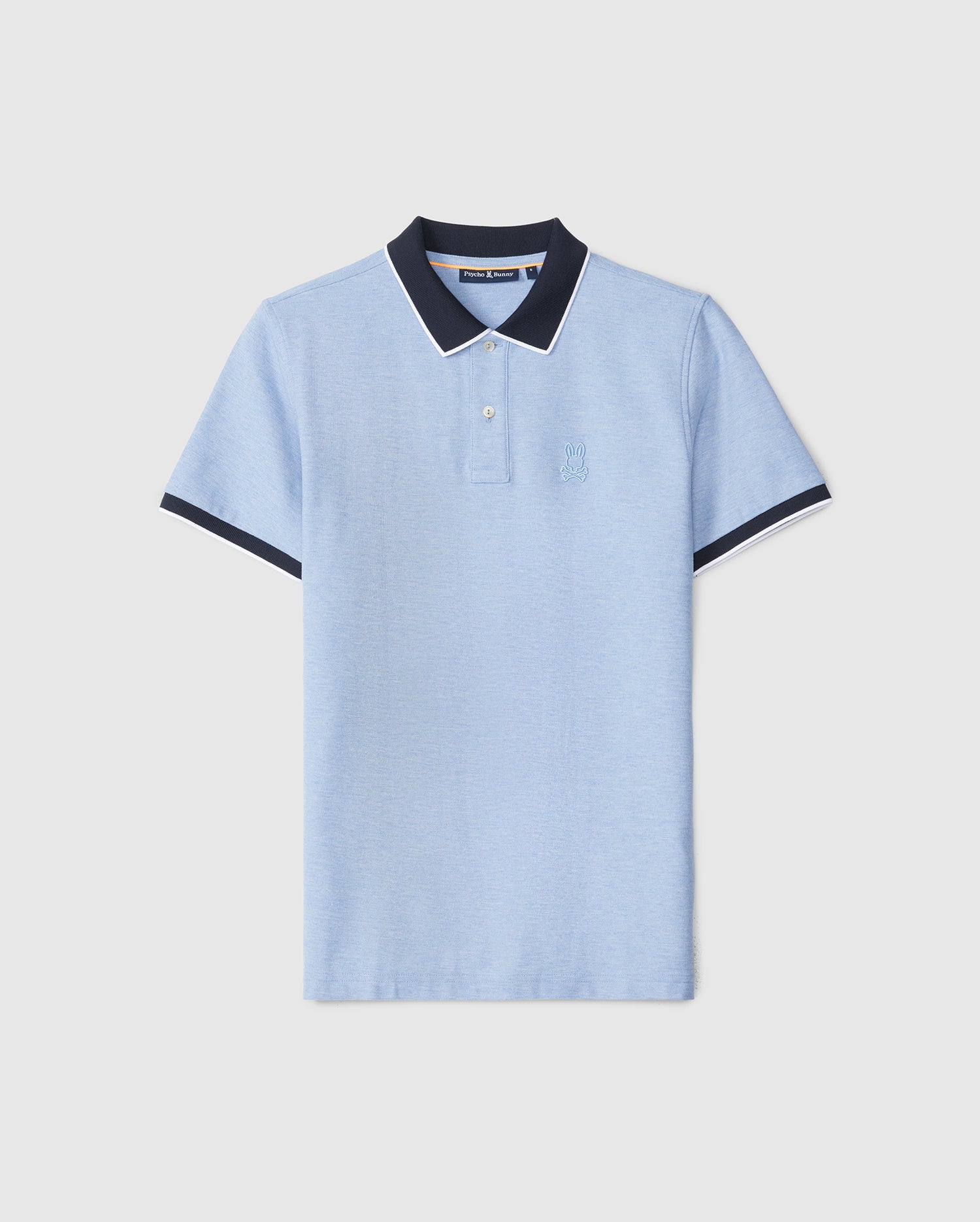 A light blue Psycho Bunny MENS WINDCREST PIQUE POLO SHIRT - B6K592C200 made of luxurious Pima cotton, featuring dark blue sleeve cuffs and collar with white piping accents. The shirt sports a small embroidered Bunny logo on the left chest and has a button-down placket.