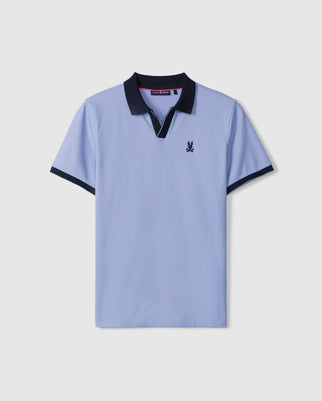 A light blue short-sleeved Psycho Bunny MENS RICHARDS JOHNNY COLLAR PIQUE POLO SHIRT - B6K641C200 with a black collar and black sleeve trim. Crafted from luxurious Pima cotton piqué, it features a small embroidered Bunny logo on the left chest.