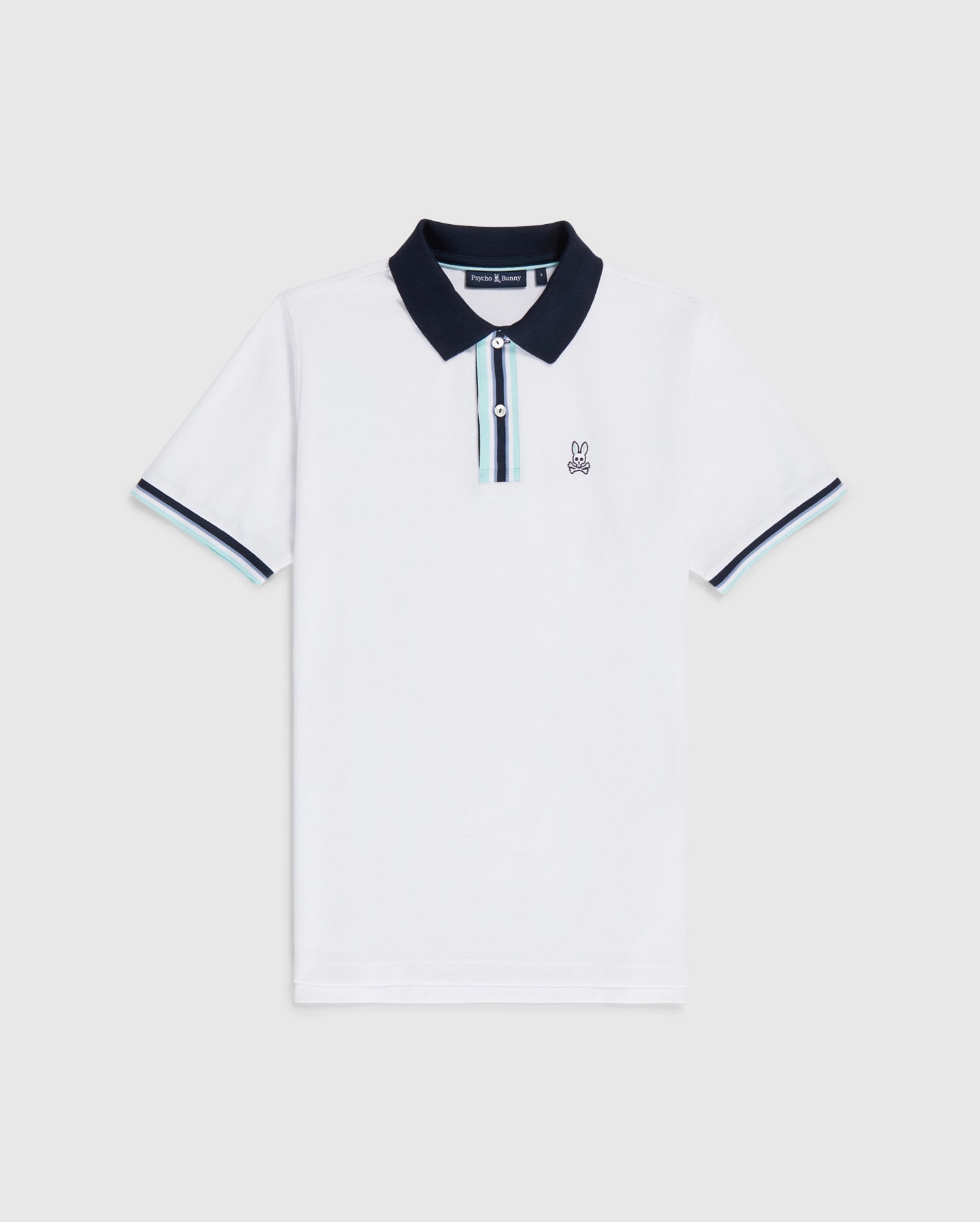 White Psycho Bunny Bloomington pique polo shirt with a navy blue collar, a small bunny logo on the left chest, and blue trim on the sleeves. The shirt is displayed against a plain background.