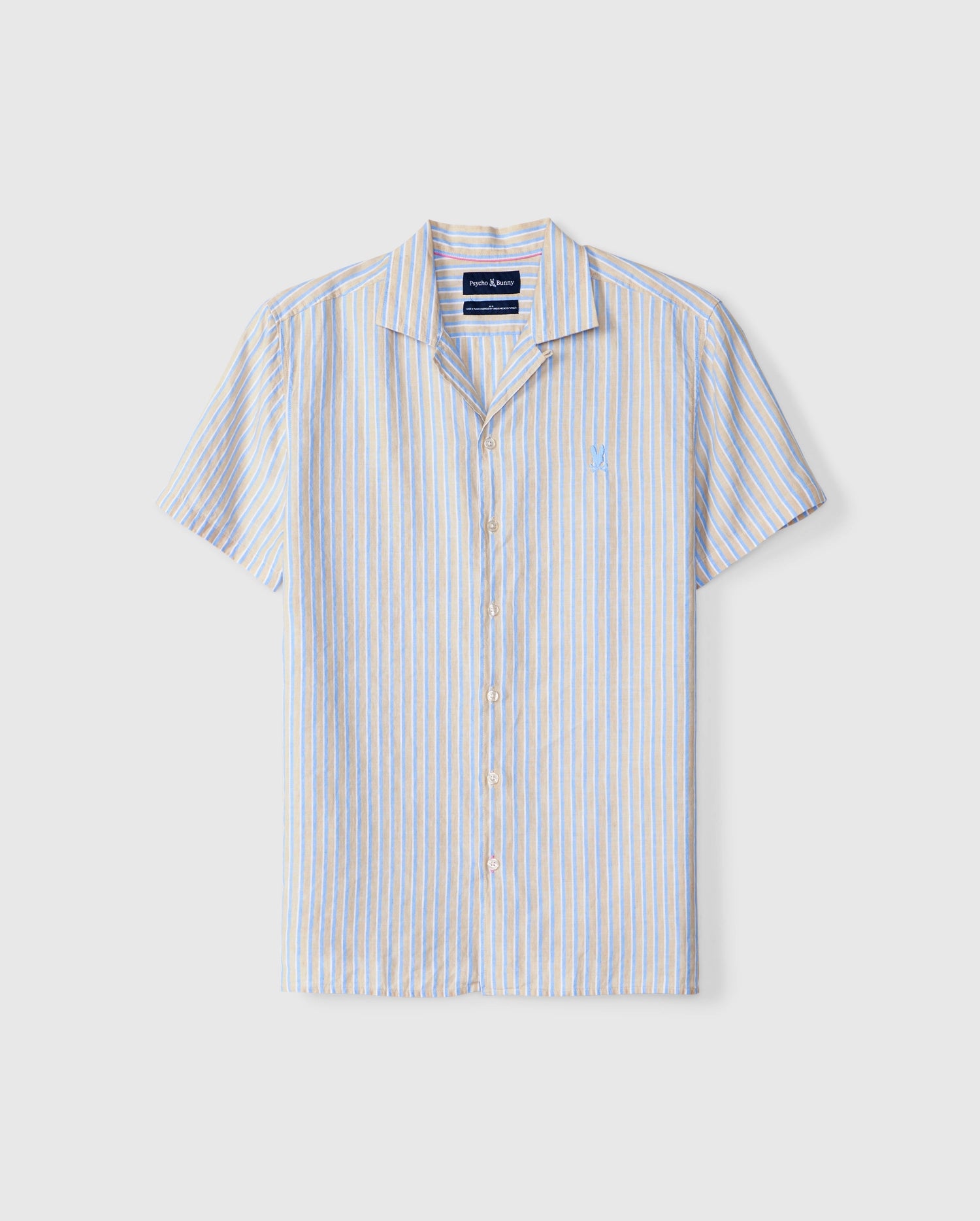 Psycho Bunny MENS JUSTIN LINEN CAMP SHIRT - B6Q585C200 short-sleeved button-up linen shirt with a collar in a vertical stripe pattern of blue, yellow, and white. This men's linen shirt features a small embroidered emblem on the left chest and is displayed on a plain white background.