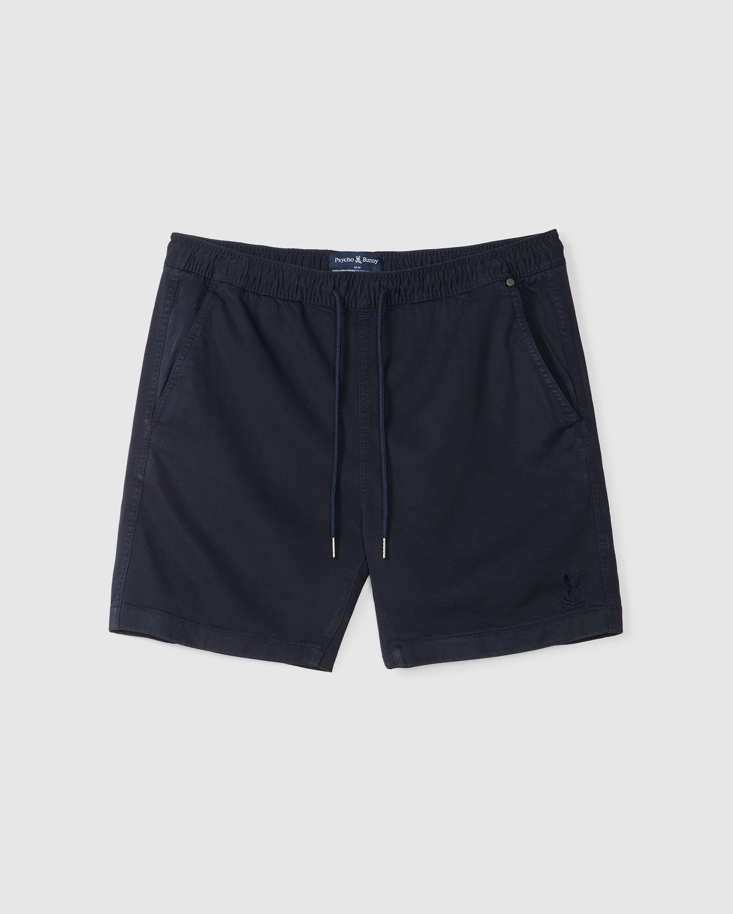 Navy blue Psycho Bunny men's stretch TENCEL™ swim shorts with elastic waistband and drawstring, featuring a small embroidered logo detail on the lower left leg.