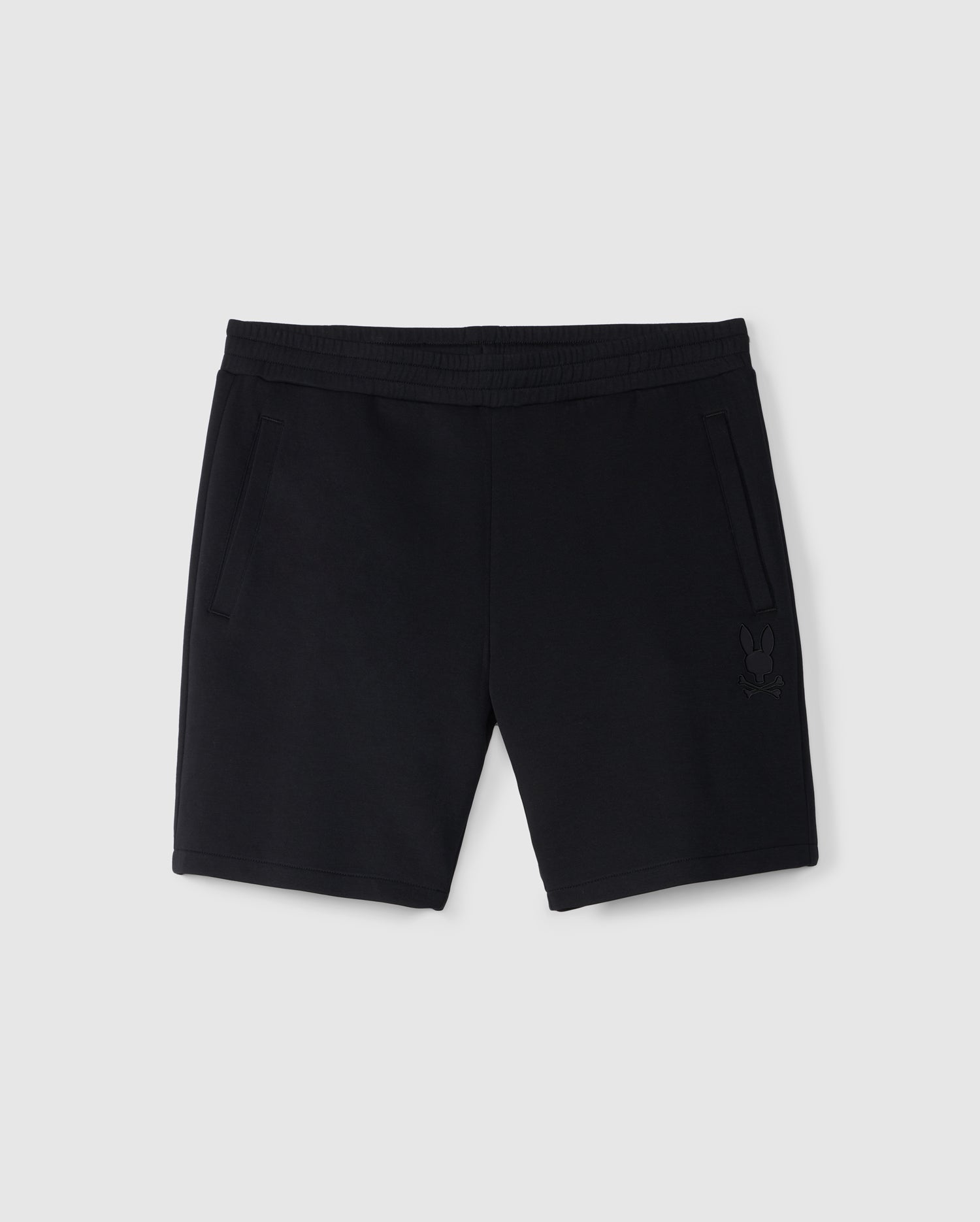 Soft stretch modal-cotton-blend jersey black shorts with an elastic waistband, featuring subtle side pockets and a small Mickey Mouse silhouette on the left leg. The MENS LYONS CASUAL SWEATSHORT - B6R578C200 by Psycho Bunny is displayed on a plain white background.