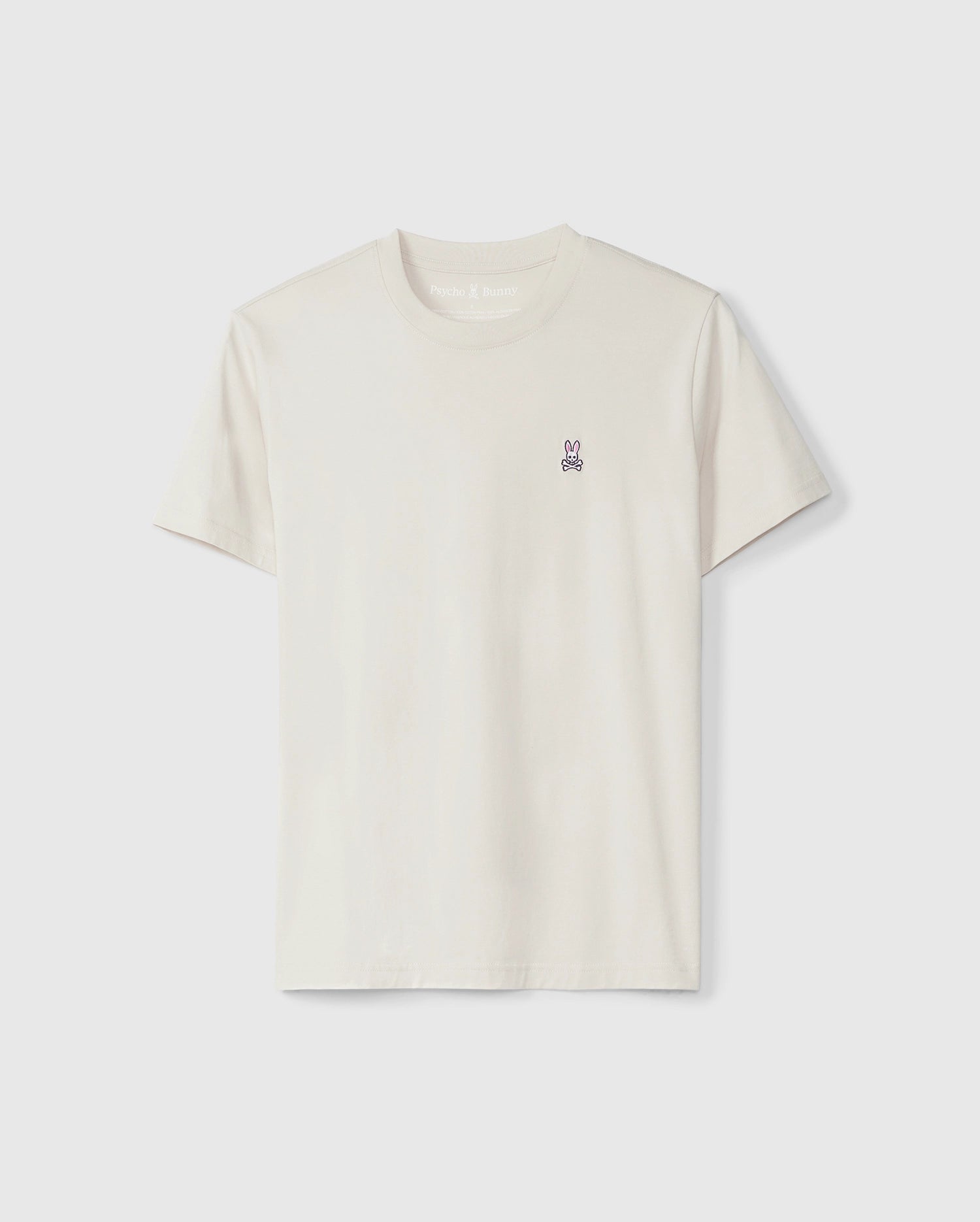 A plain, off-white Psycho Bunny Classic Crew Neck Tee with a small black and white bunny logo embroidered on the chest area, displayed on a light grey background.