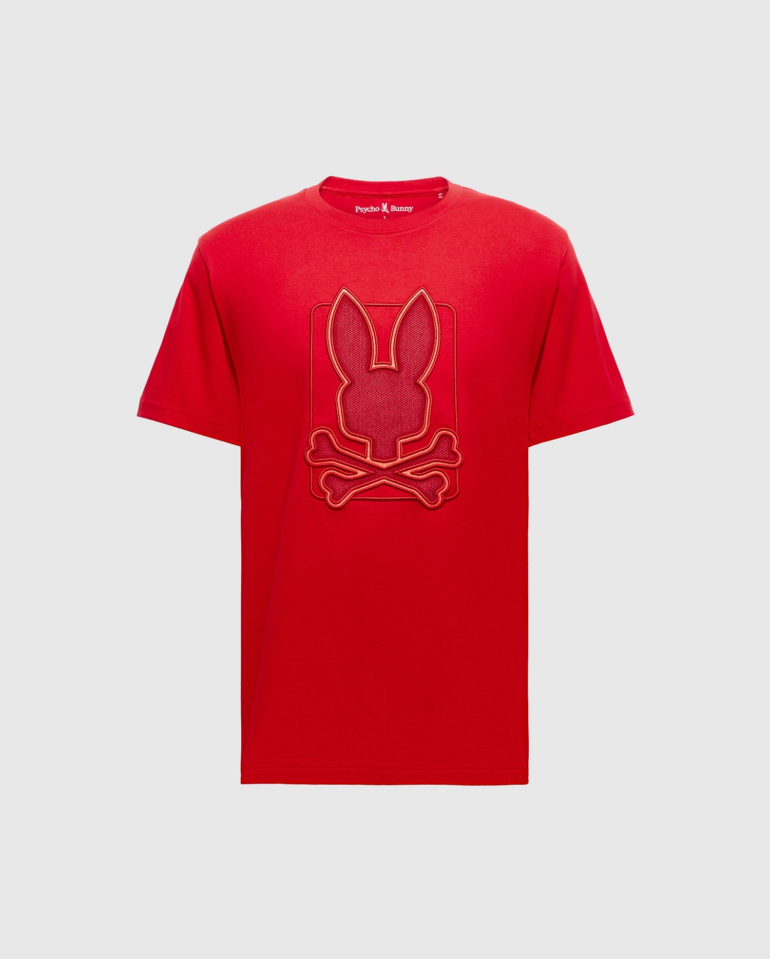 The Psycho Bunny Men's Pierce Embroidered Graphic Tee in vibrant red showcases a bunny head and crossbones logo embossed on the front, made from premium Pima cotton for ultimate comfort.