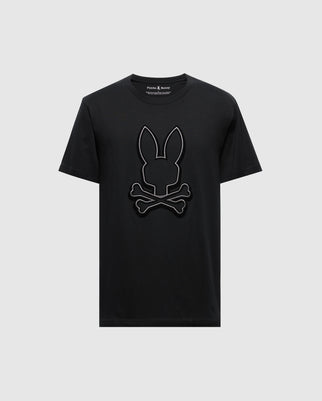 The Psycho Bunny Men's Alexander Graphic Tee in black is crafted from soft Pima Cotton. Its design features a logo with bunny ears above crossed bones, reminiscent of a skull and crossbones motif, enhanced with a subtle touch of Lurex for an added hint of flair.