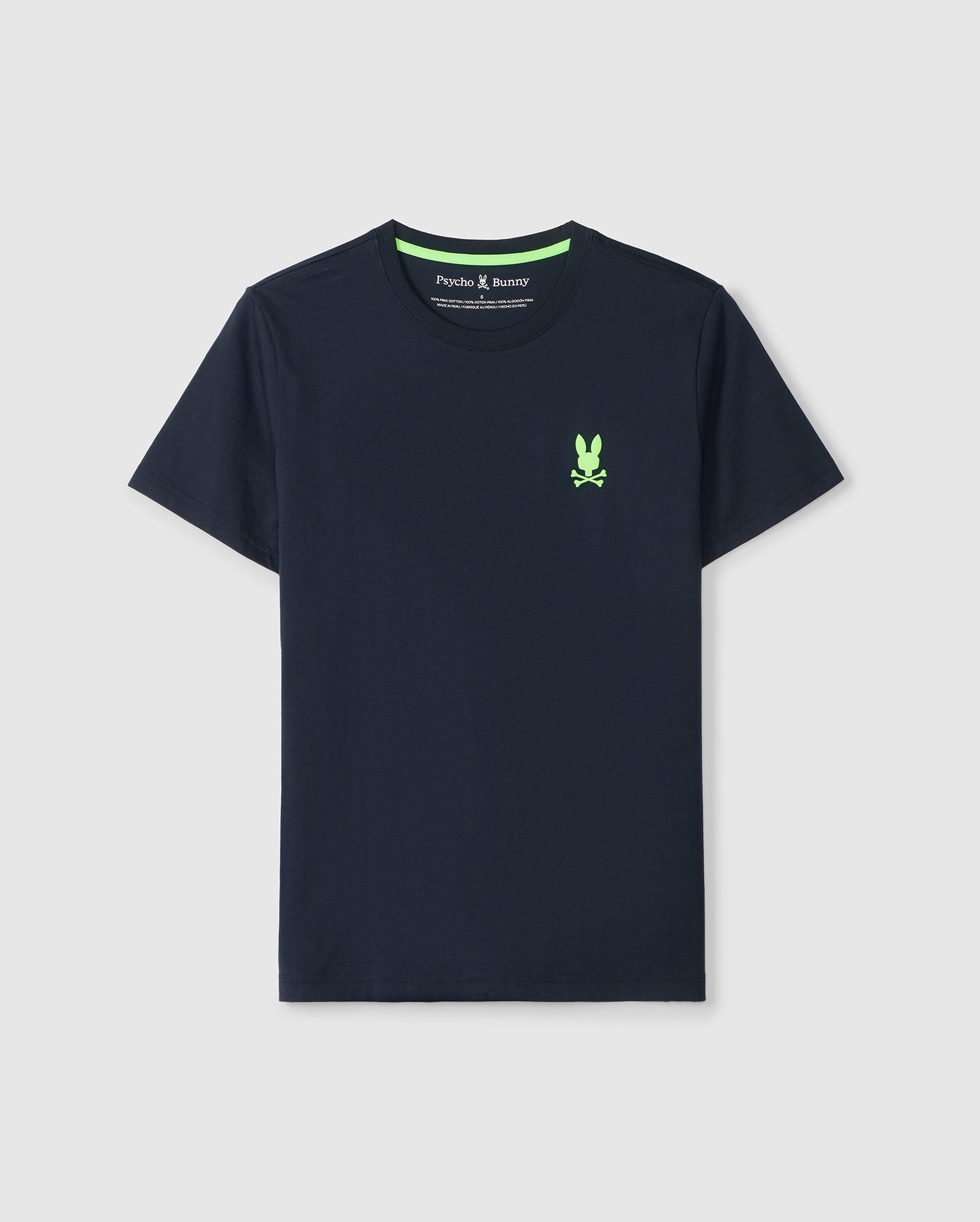 A navy blue Pima cotton tee with short sleeves, featuring a small green bunny skull and crossbones graphic on the left chest. The neckline is rounded, and the shirt boasts a simple, clean design. The Psycho Bunny label is visible inside the collar. This is the MENS SLOAN BACK GRAPHIC TEE - B6U214B2TS.