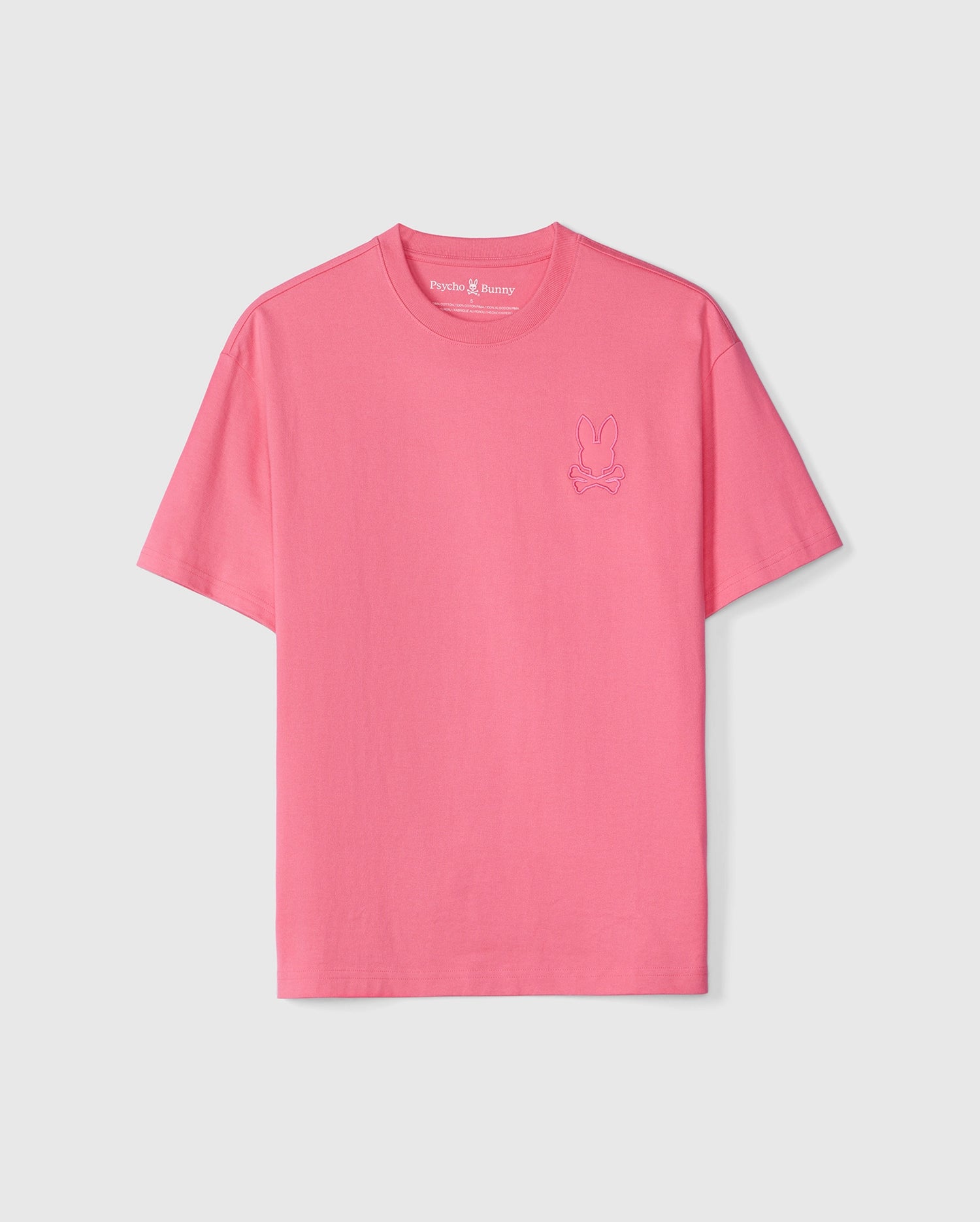 A plain pink MENS DANBY OVERSIZED TEE - B6U359B2TS with a small, purple bunny embroidered appliqué on the left chest area, displayed against a white background by Psycho Bunny.
