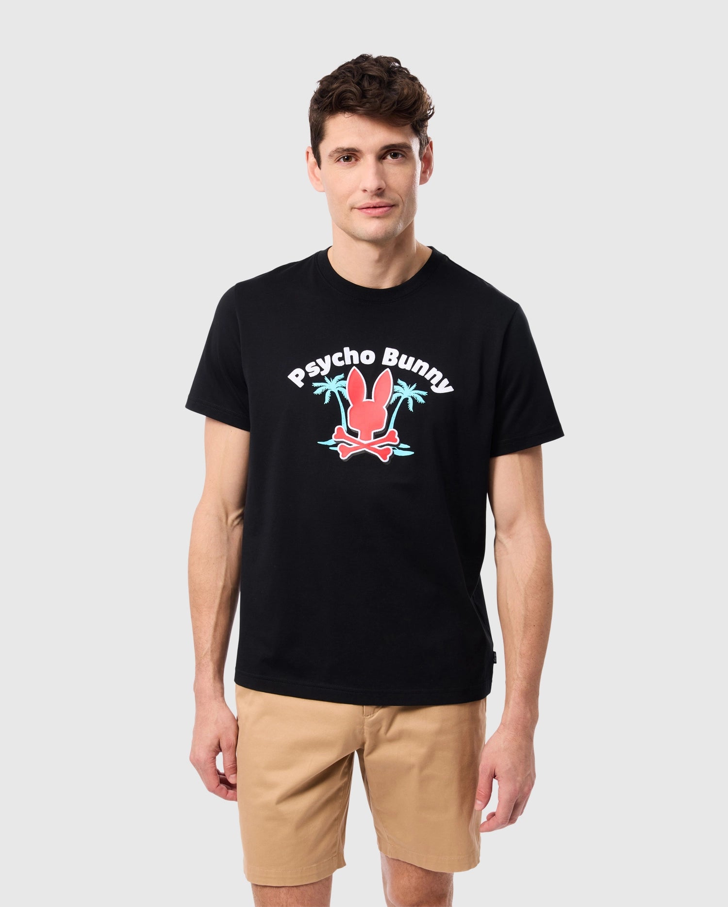 A person wearing a black MENS BOSTON GRAPHIC TEE - B6U573C200 made of soft Peruvian Pima cotton with a vibrant 