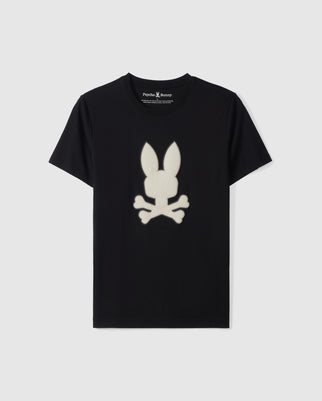 A black MENS RIVIERA GRAPHIC TEE - B6U639C200 crafted from luxurious Peruvian Pima cotton features a white, stylized bunny head with long ears above crossed bones in the center. "Psycho Bunny" is printed in small white text inside the back neckline, adding a subtle touch to this unique silicon HD design.