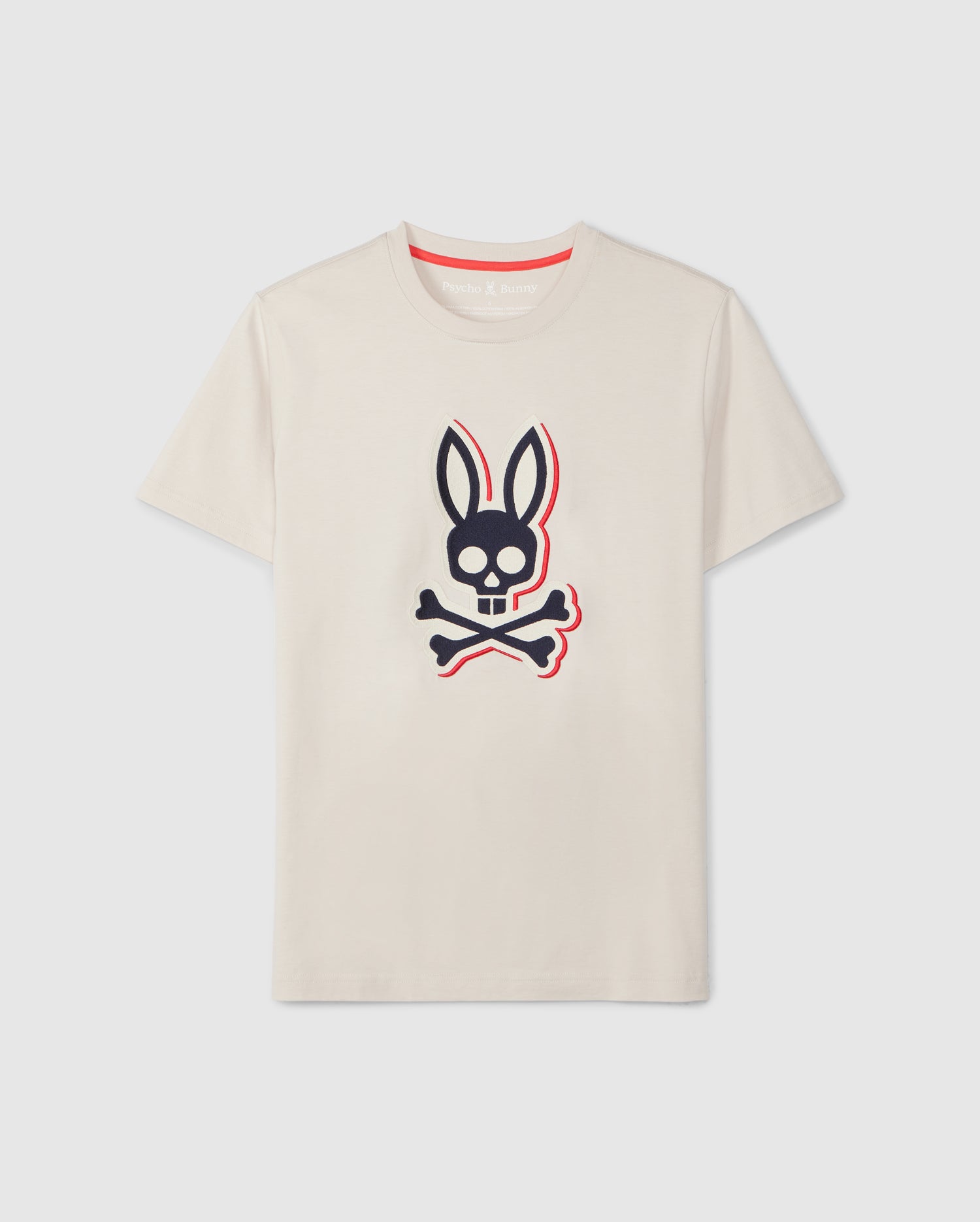 A **Psycho Bunny MENS KAYDEN GRAPHIC TEE - B6U676C200**, made from soft Pima cotton, featuring a black and red cartoonish bunny head with crossbones beneath it on the front. The shirt has a round neckline and short sleeves, displayed against a plain white background.