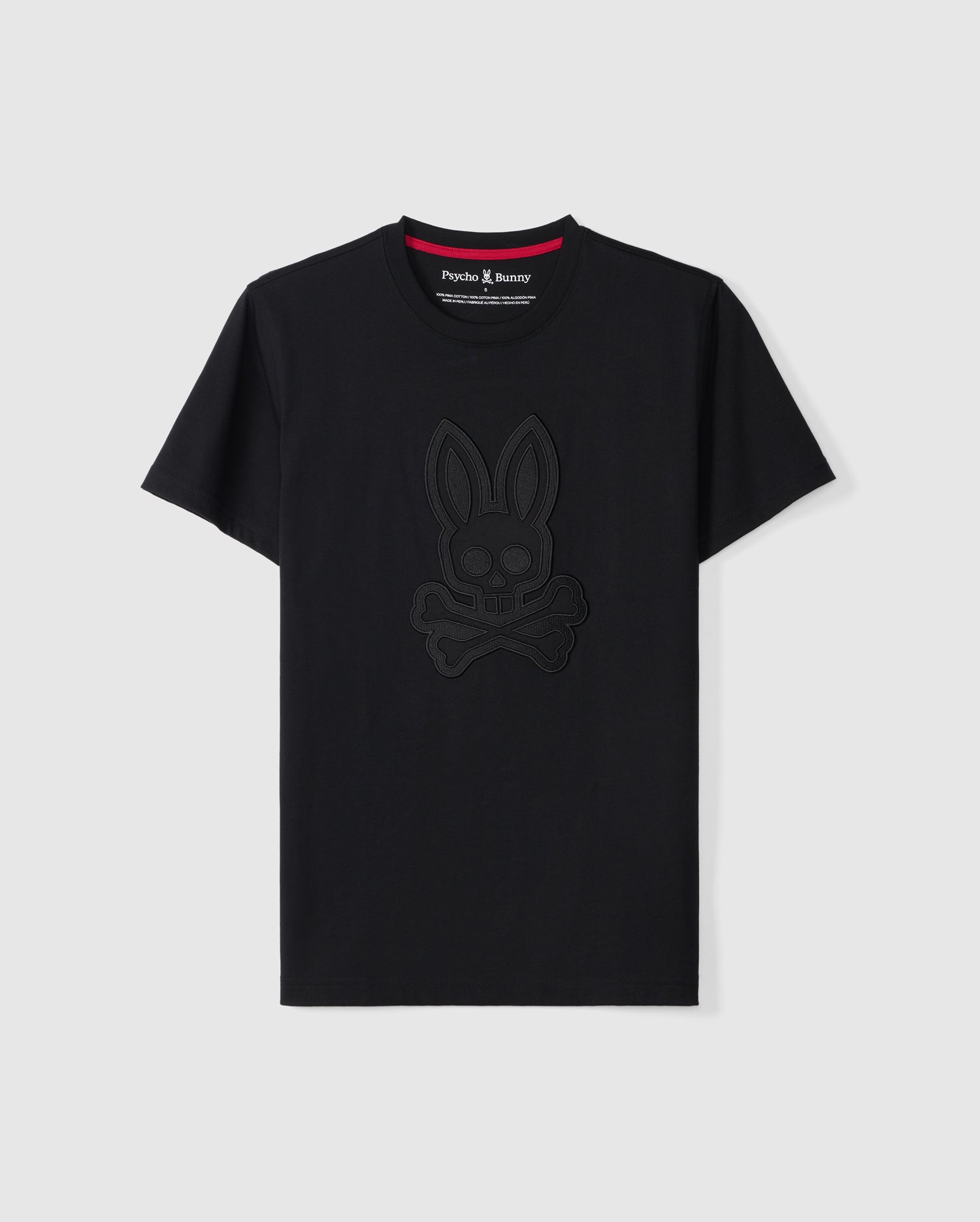 The MENS MALTON GRAPHIC TEE - B6U795D200 by Psycho Bunny is a black short-sleeve T-shirt made from luxurious Pima cotton. It showcases an embossed bunny with crossbones design on the front, featuring a contrasting red lining on the neckline and a small 