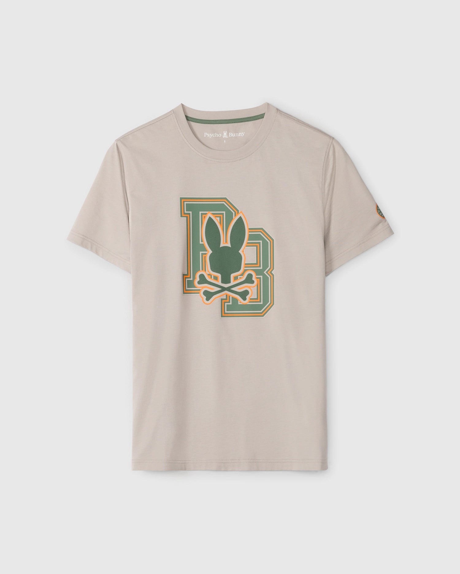 The MENS ZACK GRAPHIC TEE - B6U897D200 by Psycho Bunny is a beige short-sleeve Pima cotton T-shirt featuring a large green and orange emblem on the front. The graphic design includes a stylized 