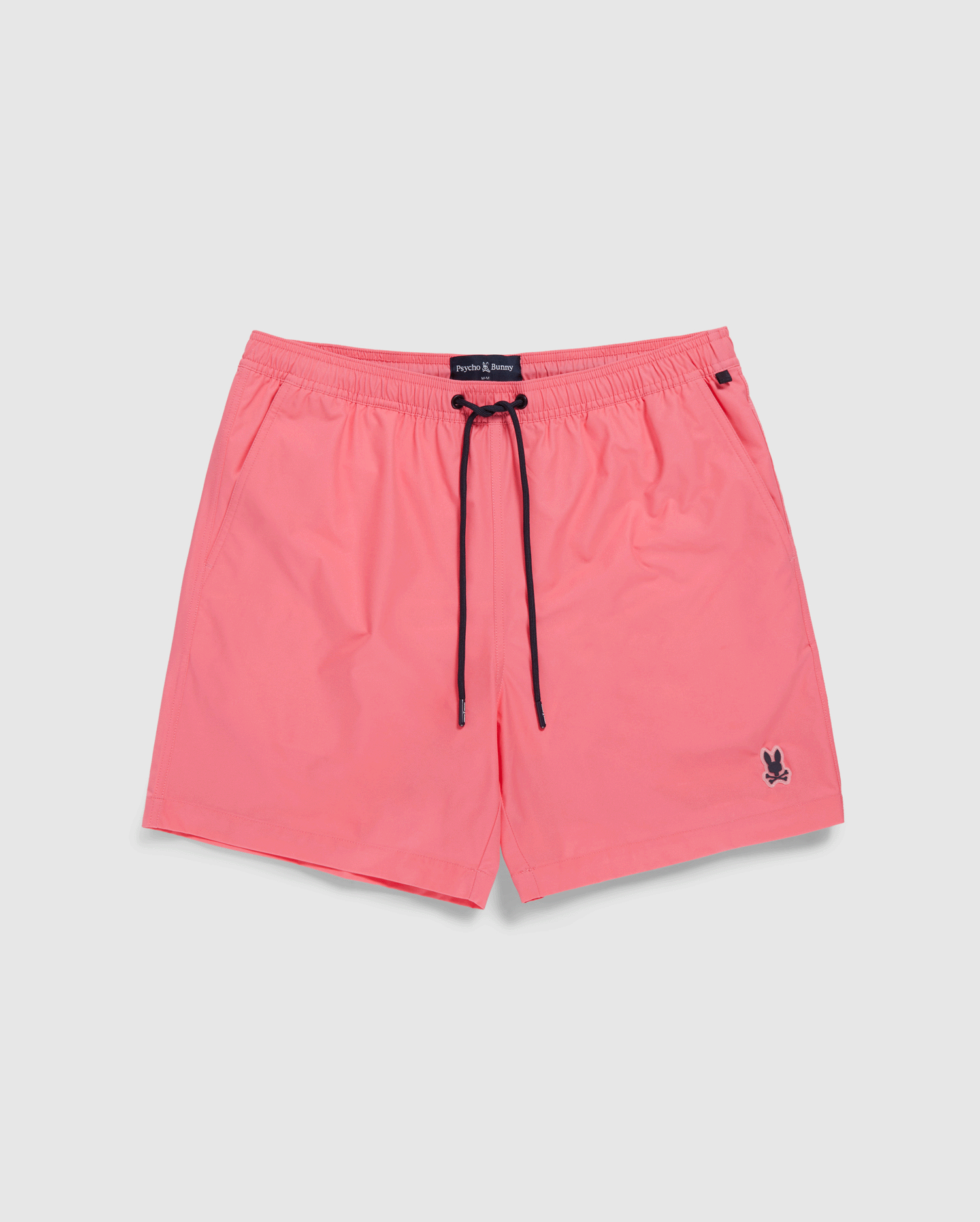 Bright pink Psycho Bunny MENS MALTA HYDROCHROMIC SWIM TRUNK with a black drawstring and a small dark logo on the lower left leg, displayed on a plain white background.