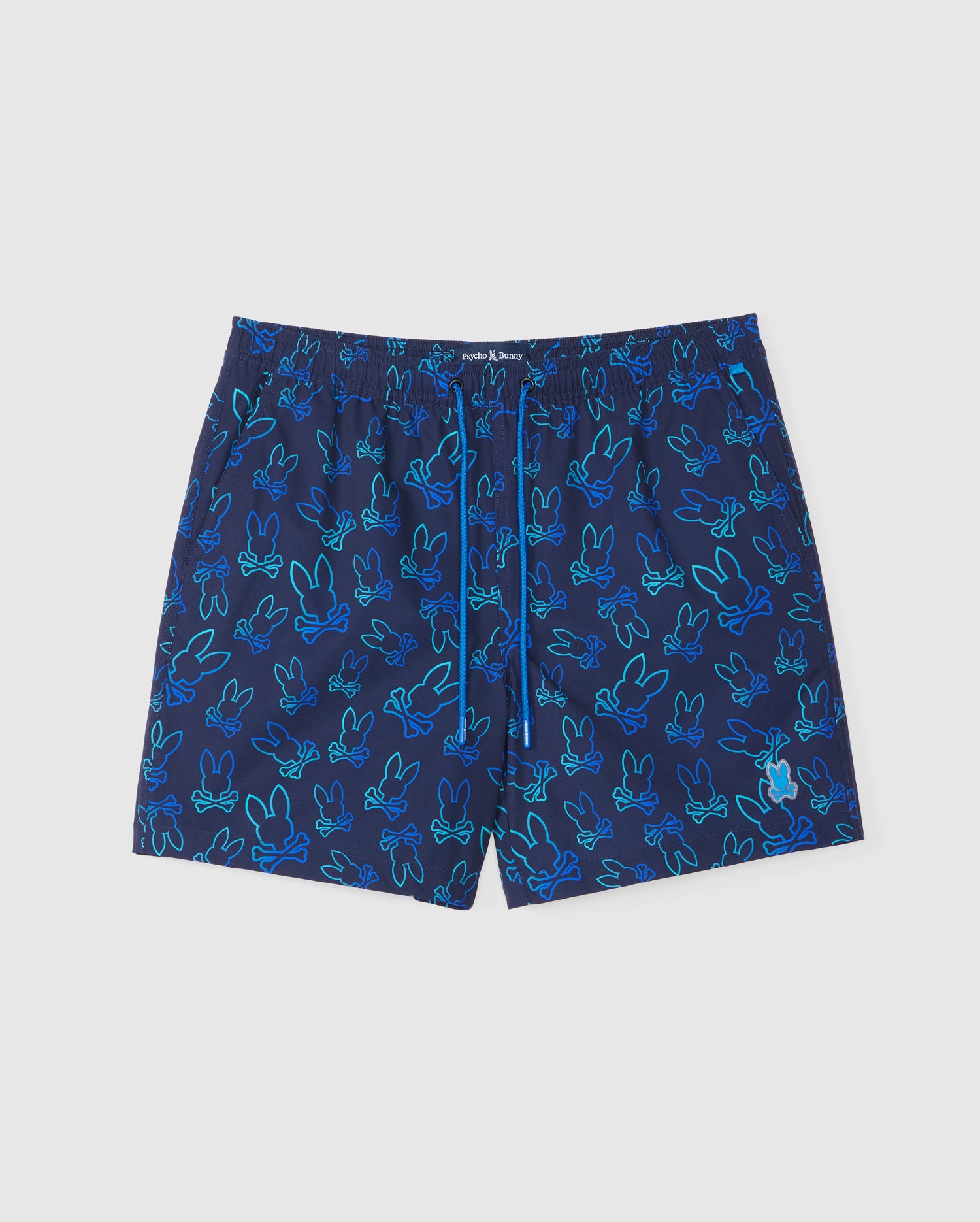 Psycho Bunny MENS SHELDON ALL OVER PRINT SWIM TRUNK - B6W588C200, with a playful, repeating bunny pattern in various shades of blue, featuring lighter blue and cyan outlines. Made from quick-dry fabric, the shorts have an elastic waistband and a drawstring for adjustment.