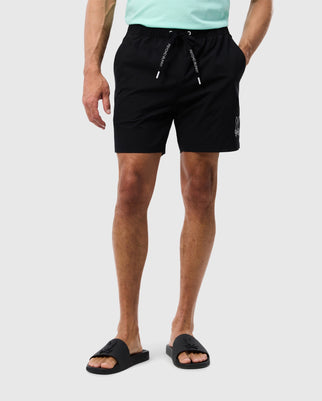 male model wearing men's parker hydrochromic swim trunk in black