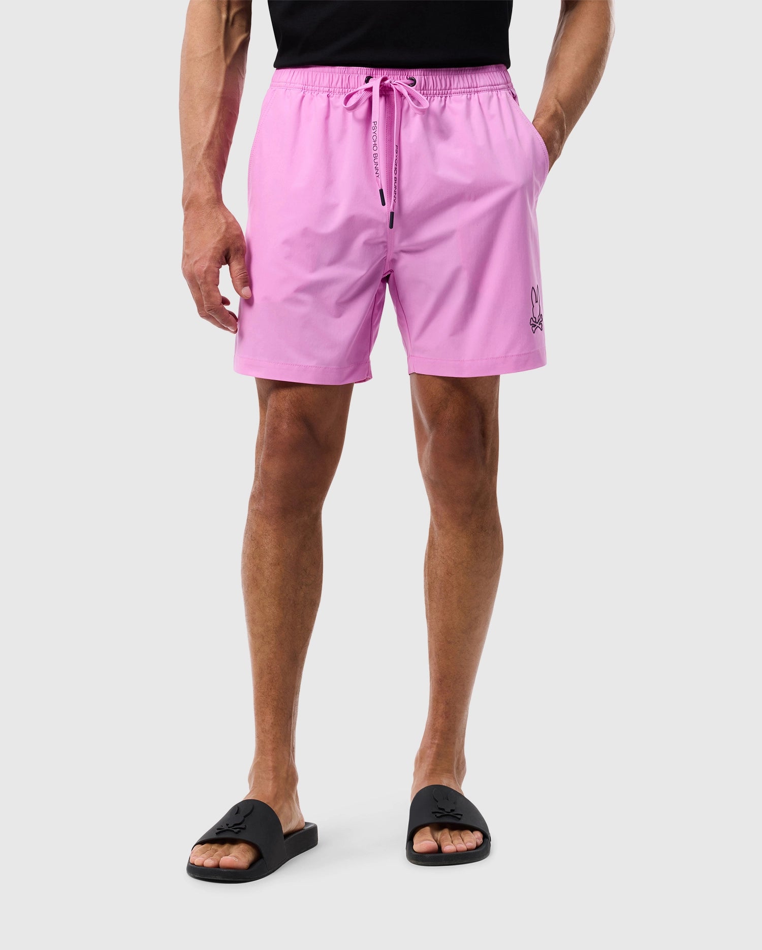 Front view of a male model wearing the mens parker hydrochromic swim trunk in violet