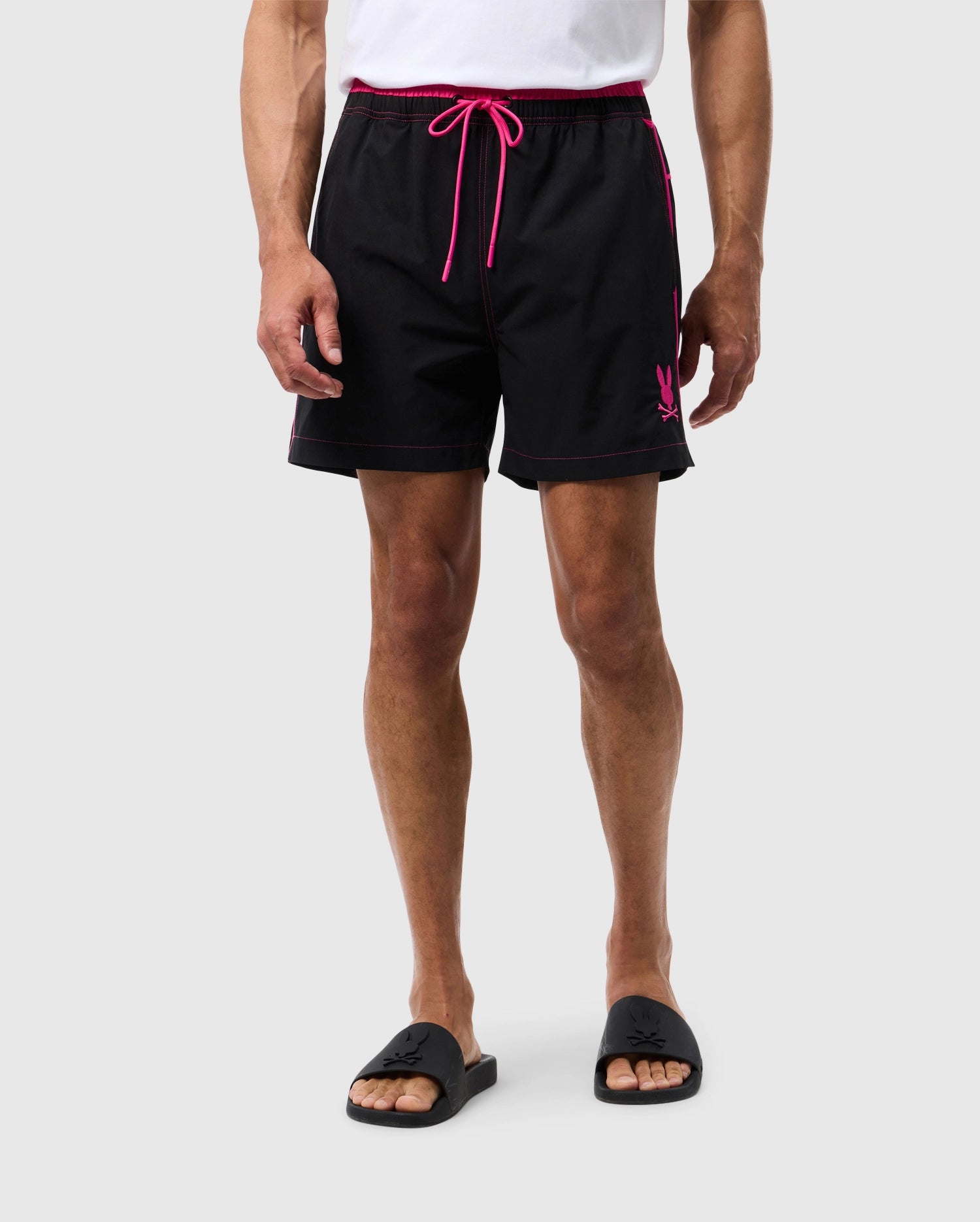 Male model wearing men's rockdale lightweight swim trunk in black