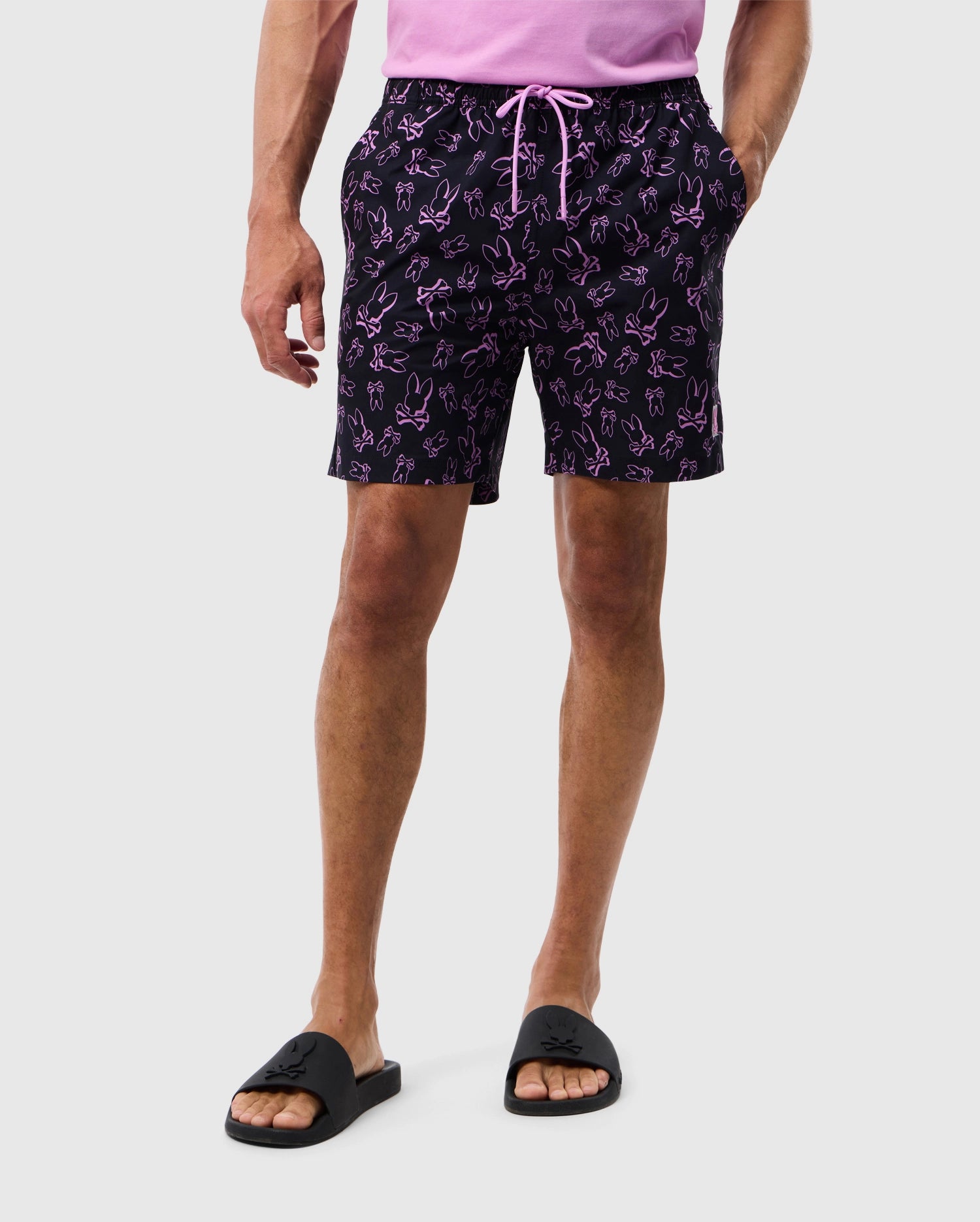 Male model wearing men's rendon print swim trunk in black