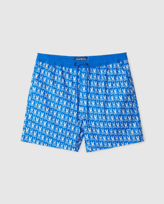 Meet Psycho Bunny's Tilden All Over Bunny Print Swim Trunk in blue: vibrant bunny patterns, an elastic waistband for comfort, and a quick-dry membrane for spontaneous water fun. Enjoy playful style and functionality all summer.