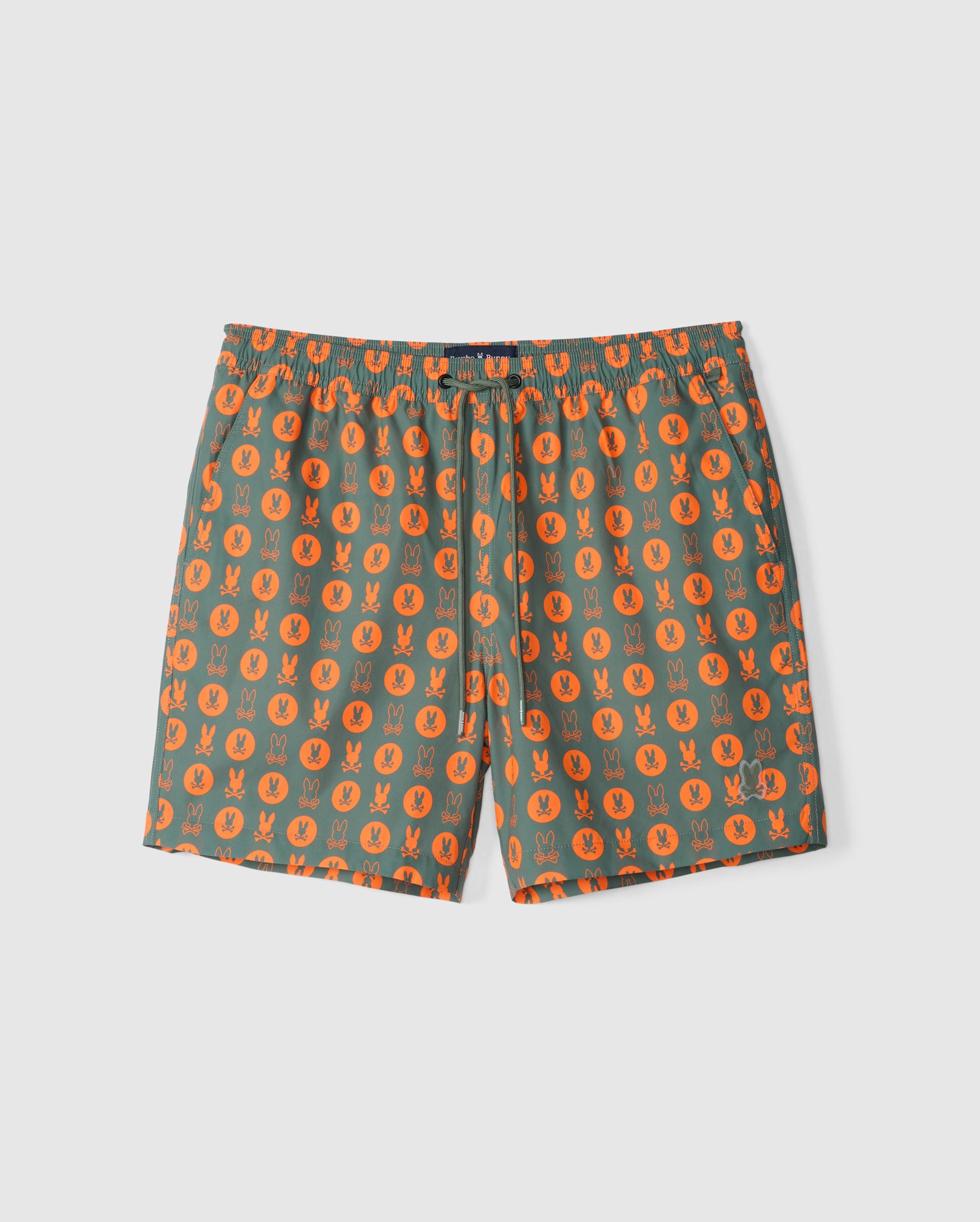 The Psycho Bunny MENS ARNOLD PRINT SWIM TRUNK - B6W820D200 features green swim shorts adorned with an orange geometric rabbit pattern. Made from quick-dry material, these shorts offer a comfortable stretch mesh lining and an elastic waistband with a drawstring. Set against a plain white background.